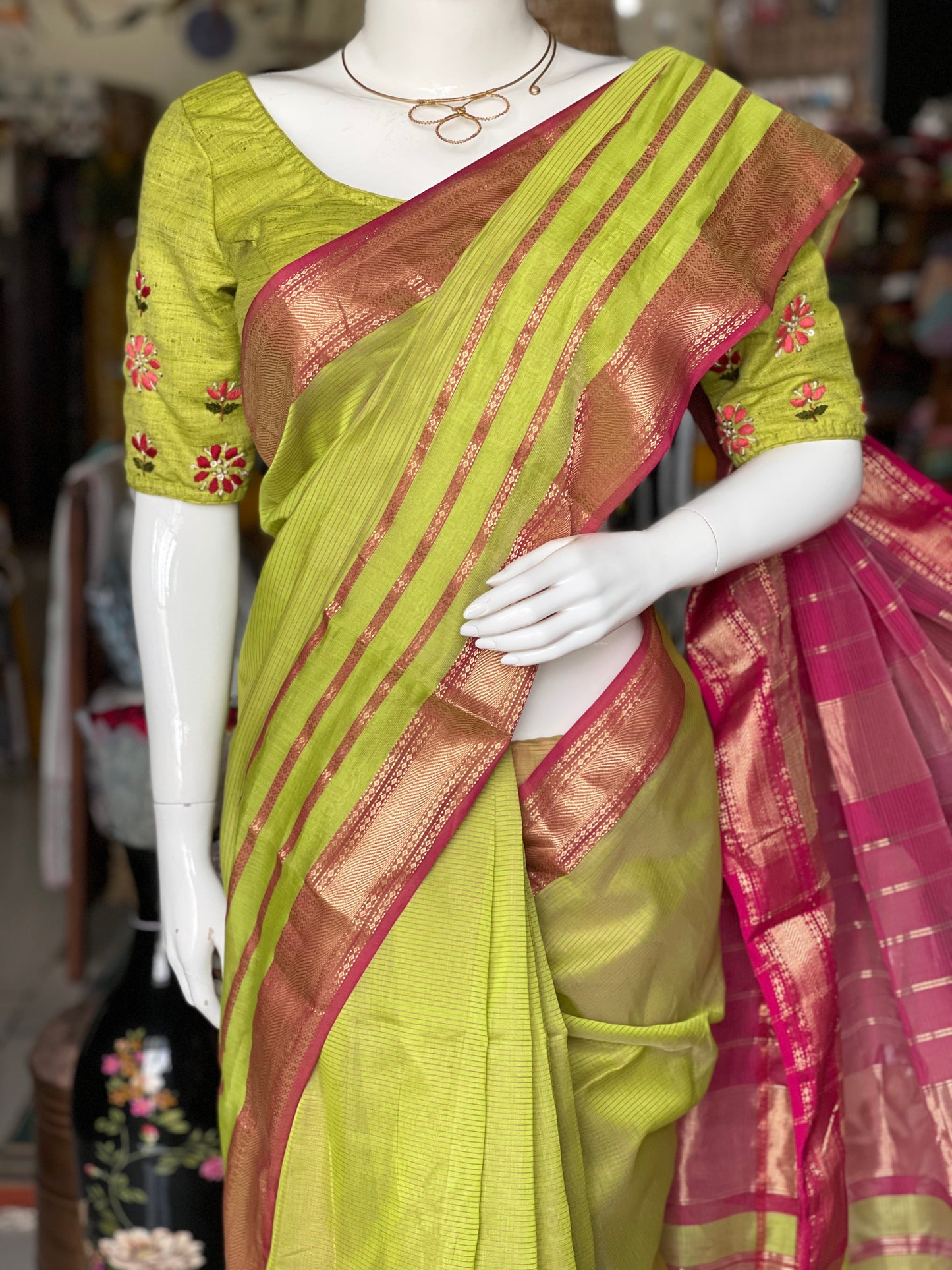 Parrot green silk cotton Maheshwari handloom saree with multiple thin stripes pink border