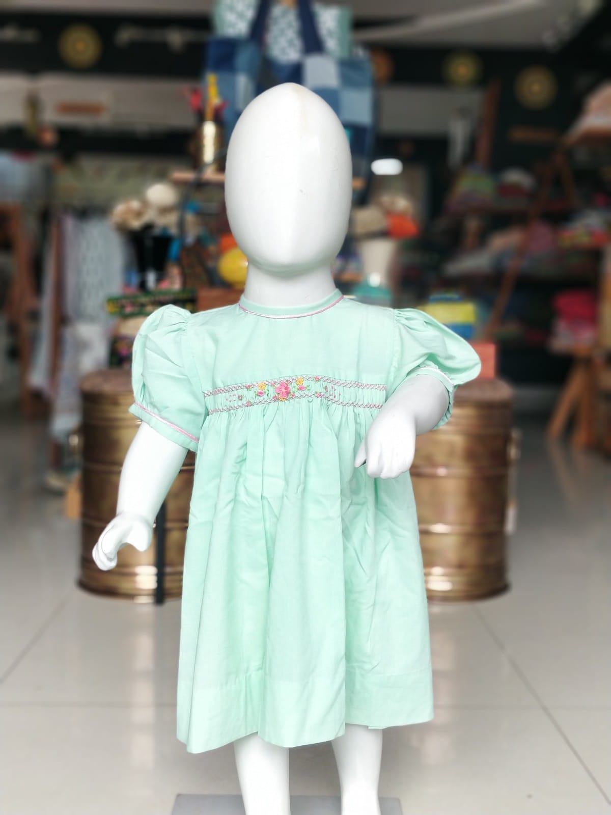 Pastel green hand embroidered smocking frock for little girls