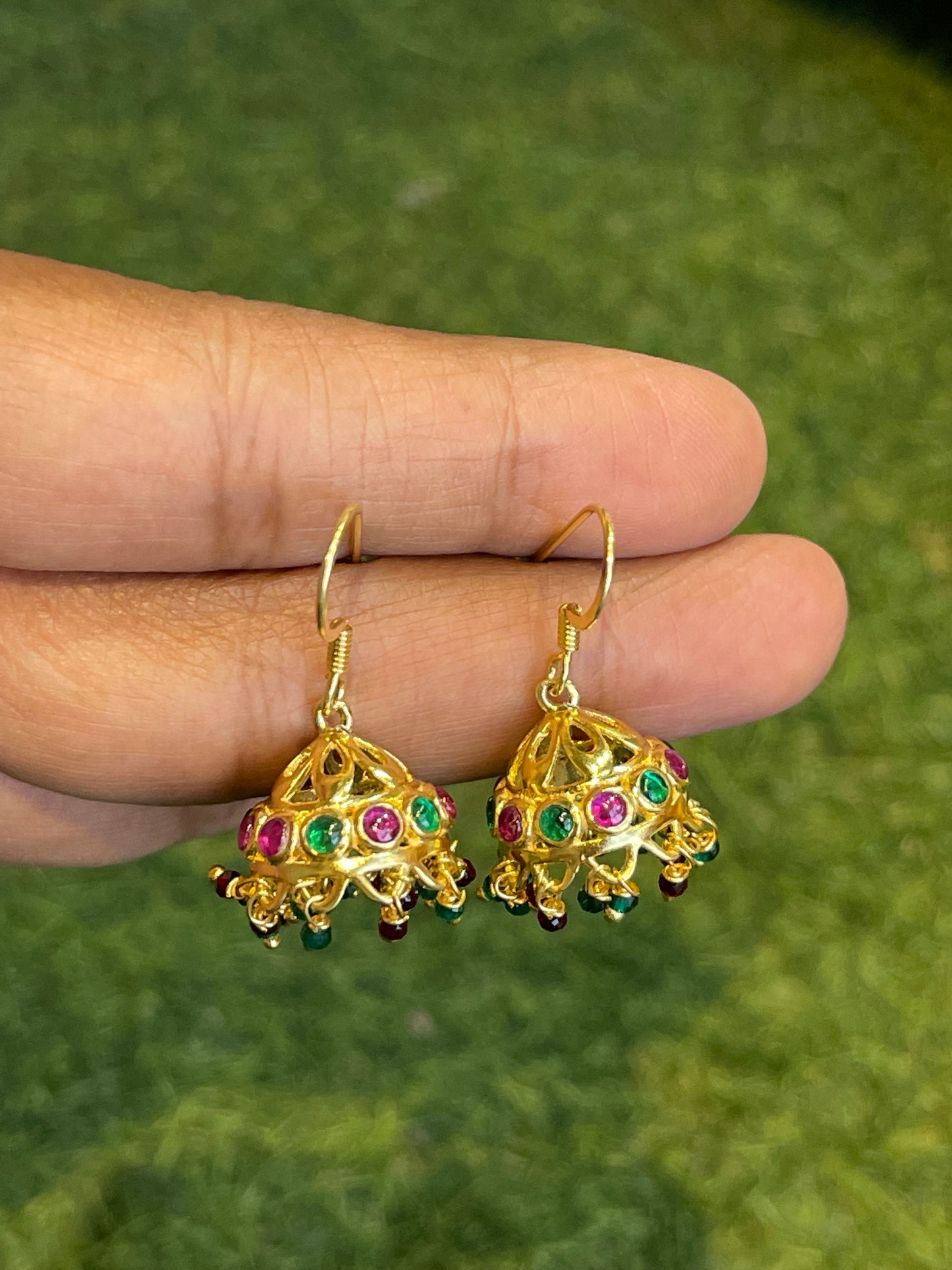 Gold polish jhumkis with pink and green stones in 92.5 sterling silver hooks earrings
