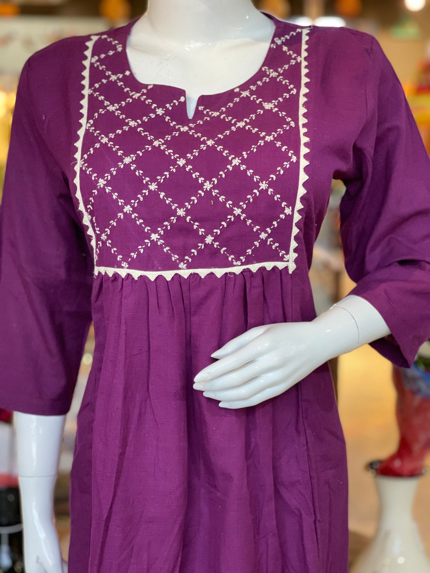 Purple cotton kurti with white hand embroidery on yoke