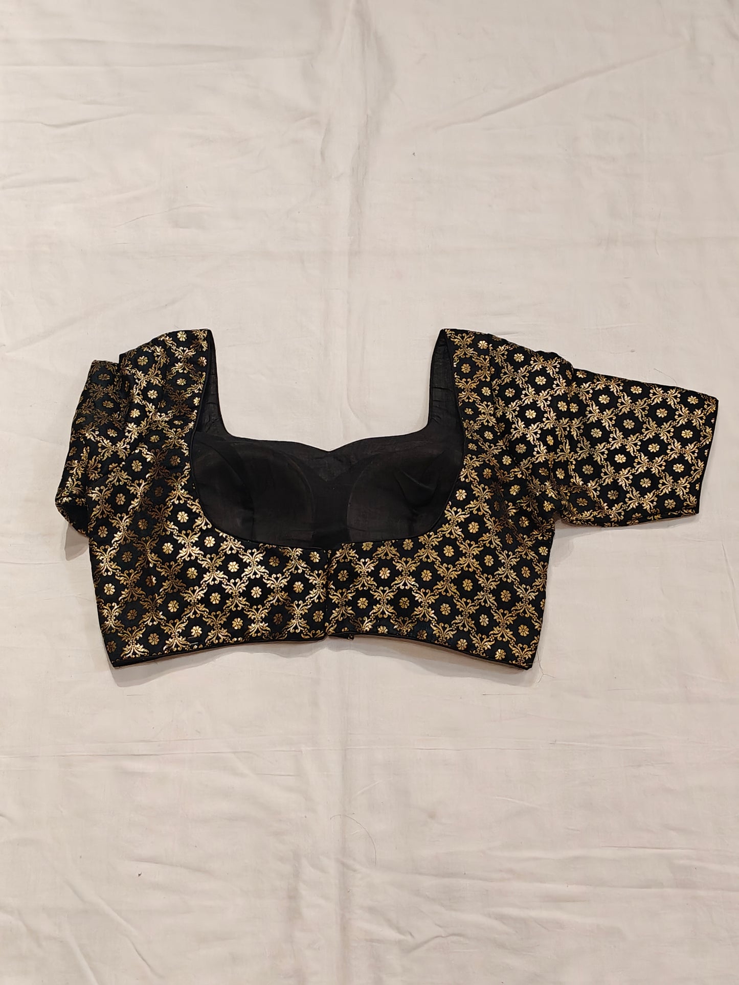Golden floral prints on black katan silk blouse