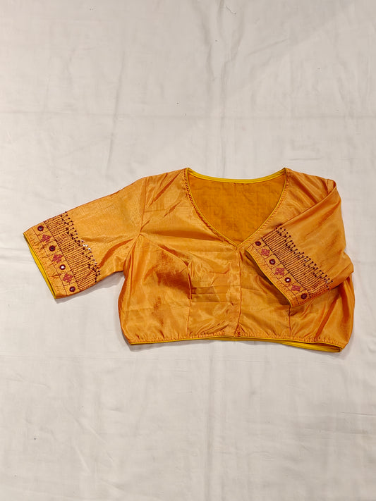 Orangeish yellow silk blouse with Kutchi hand mirror embroidery for back and sleeves