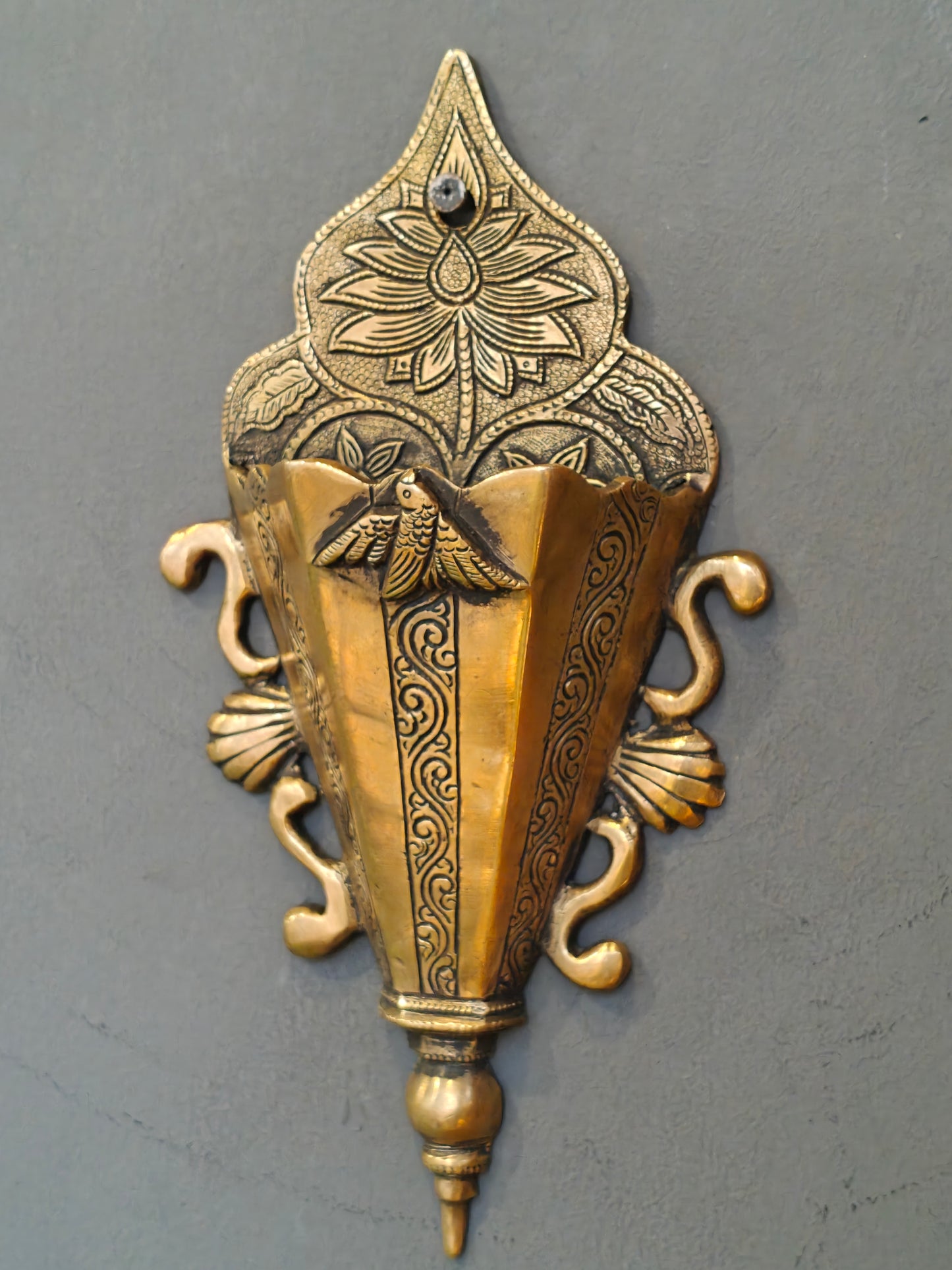 Brass wall pocket featuring intricate traditional engravings - wall decor cum organizer