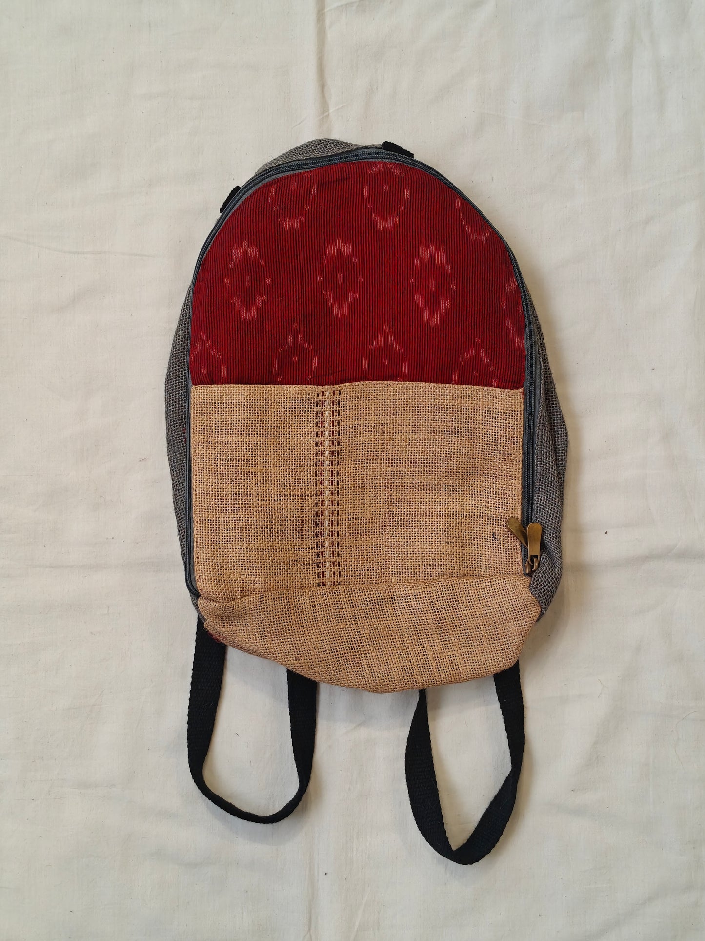 Day back pack cum handbag in jute with fabric panel