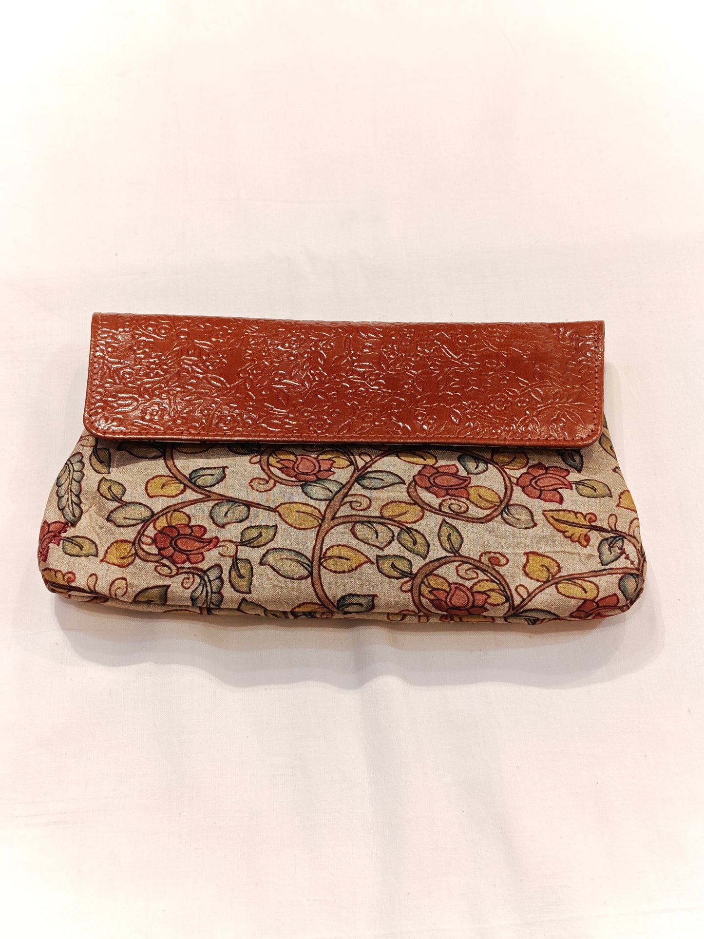 Leather hand embossed flap purse with hand block printed fabric base