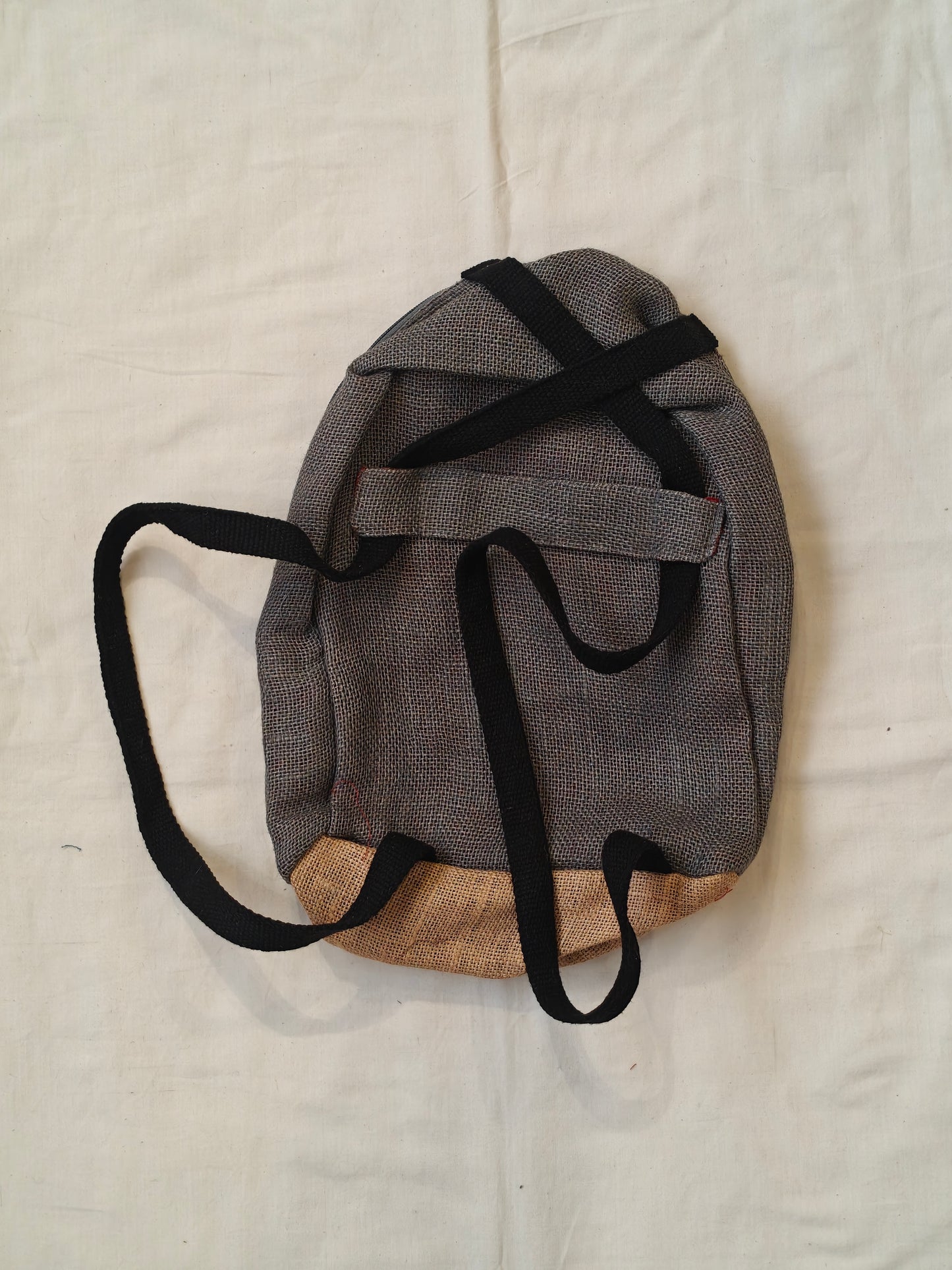 Day back pack cum handbag in jute with fabric panel