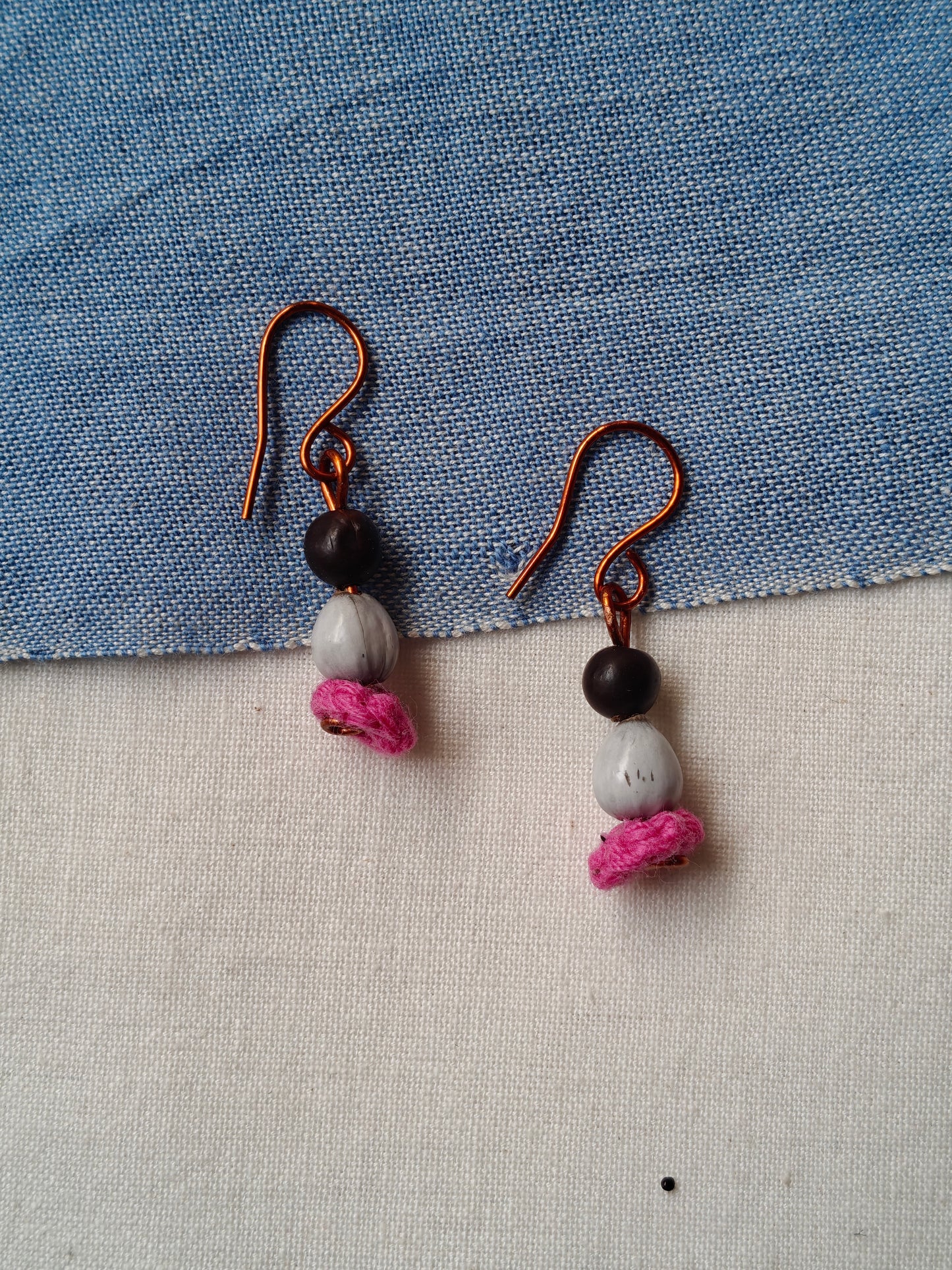 Handcrafted earrings with seeds and crochet flowers