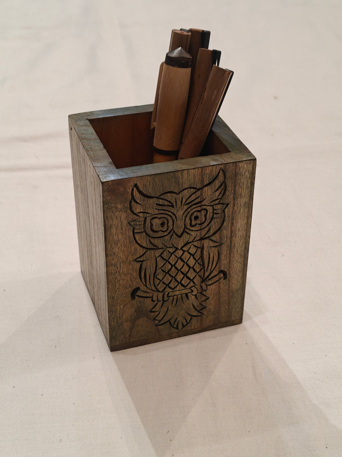 Wooden handcrafted pen stand with carved design on it - available in different colors