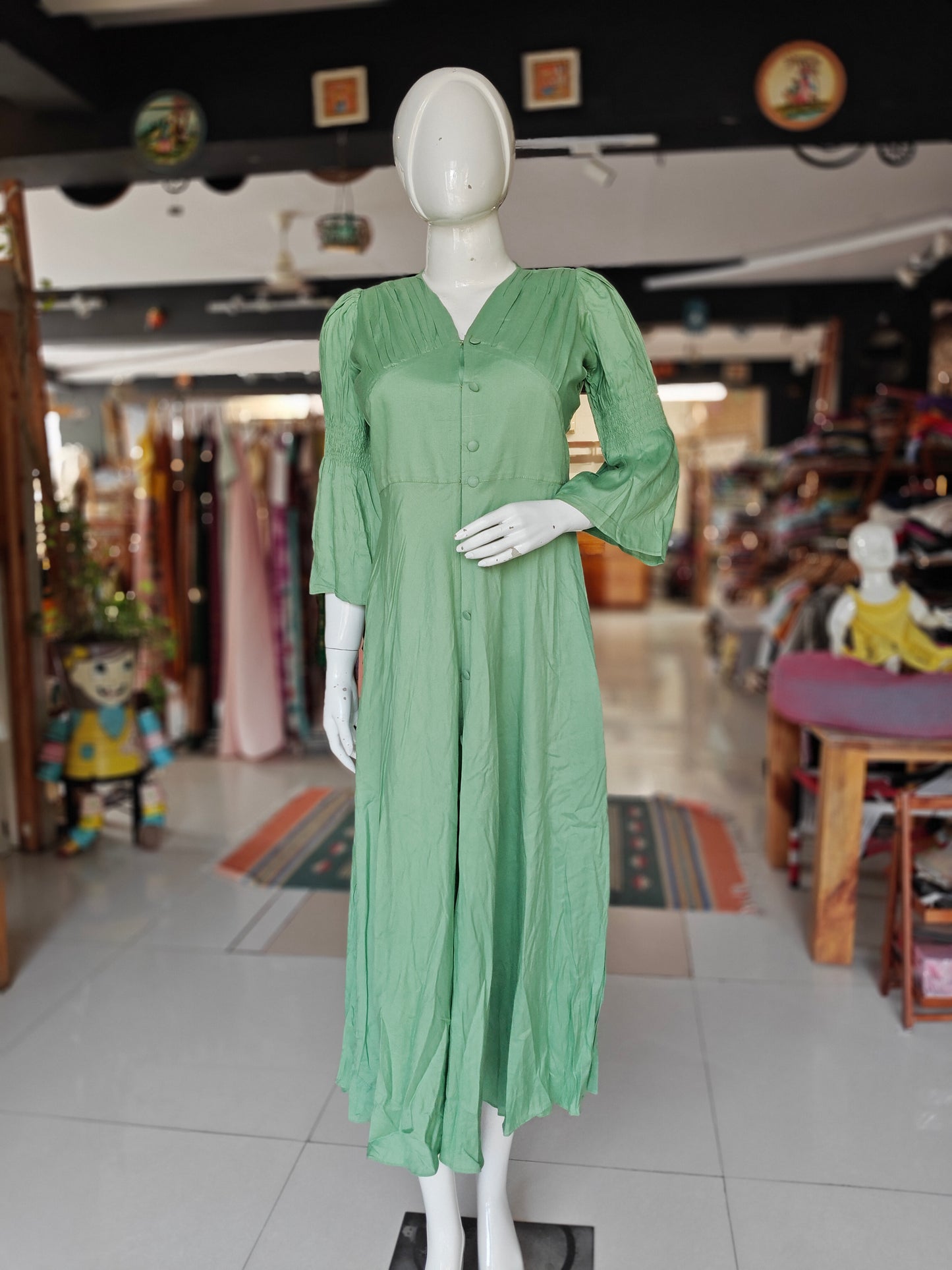 Sea green rayon pleated yoke dress with buttons detailing