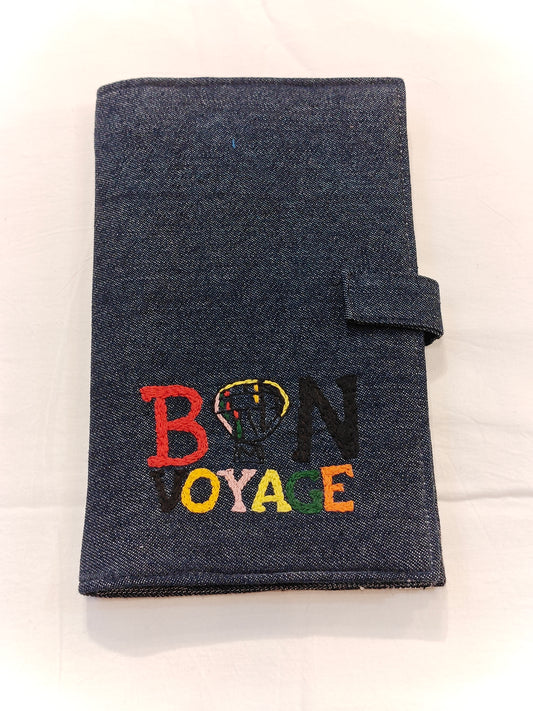 Denim fabric passport featuring embroidered "BON VOYAGE"