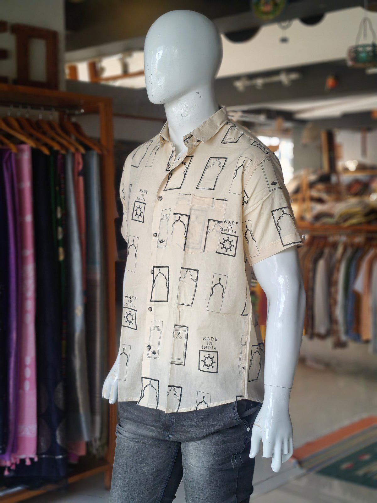 Off-white casual short sleeved shirt with architectural motifs and "Made in India" hand block prints