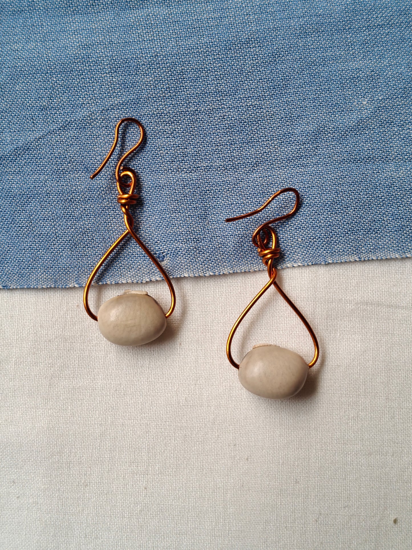 Handcrafted seed earrings with copper hooks