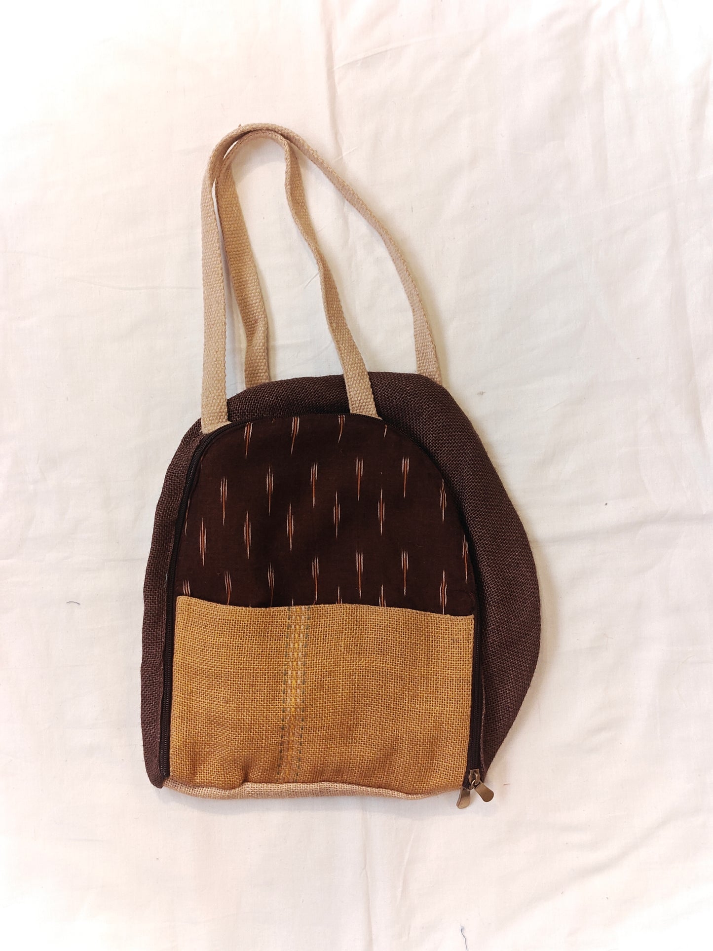 Day back pack cum handbag in jute with fabric panel