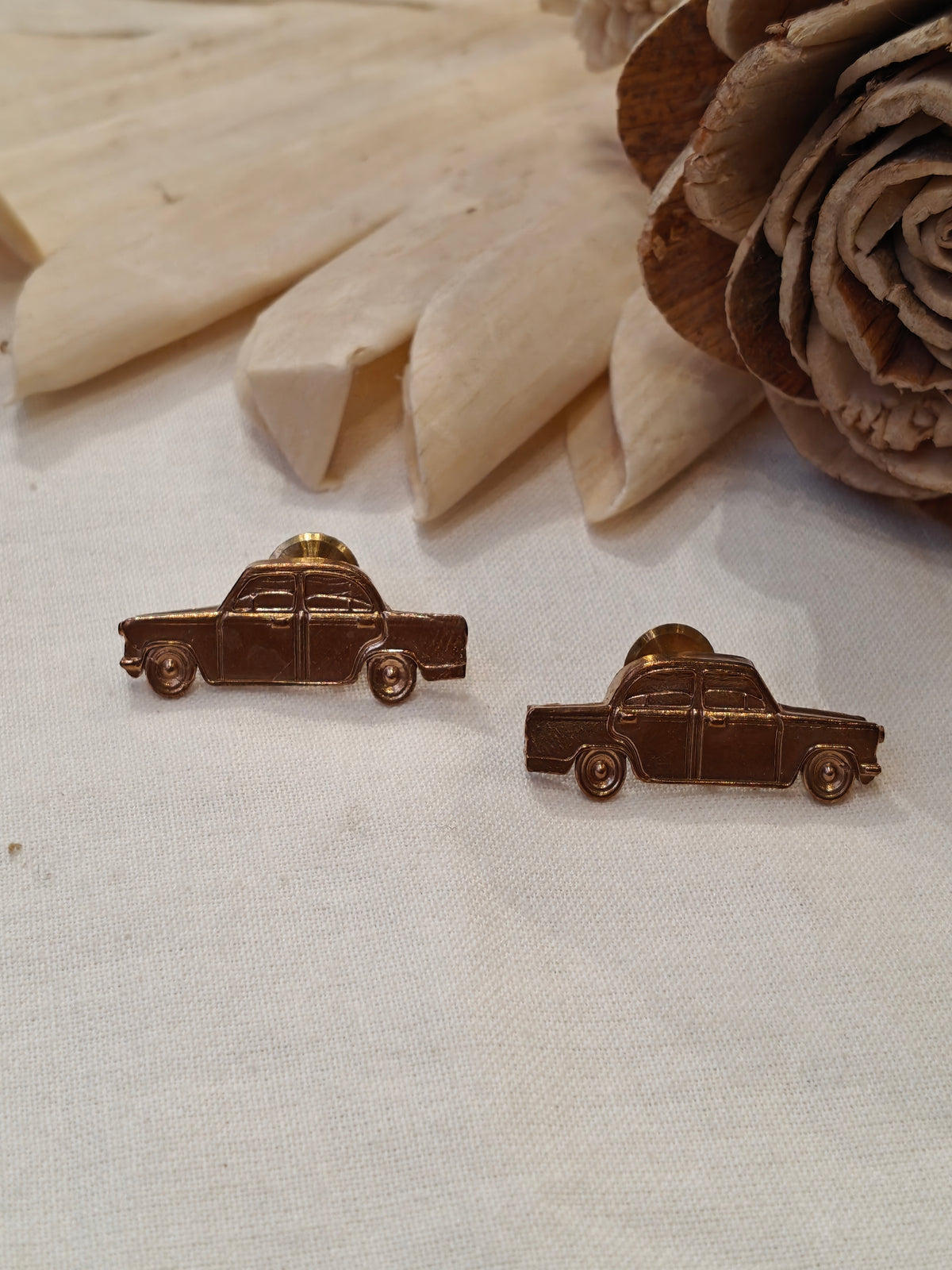 Car shaped brass stud earrings