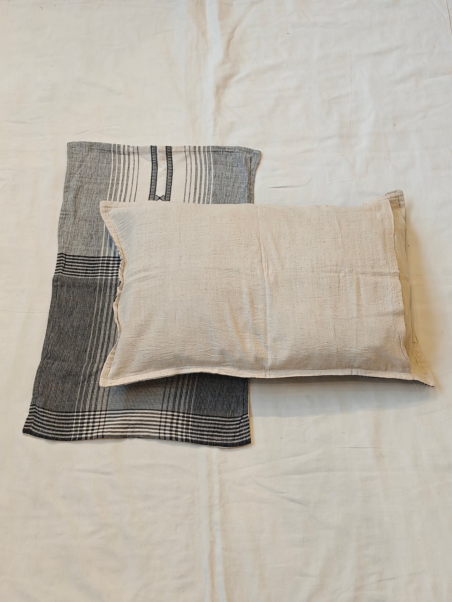 Handwoven black n white pillow cover featuring striped patterns