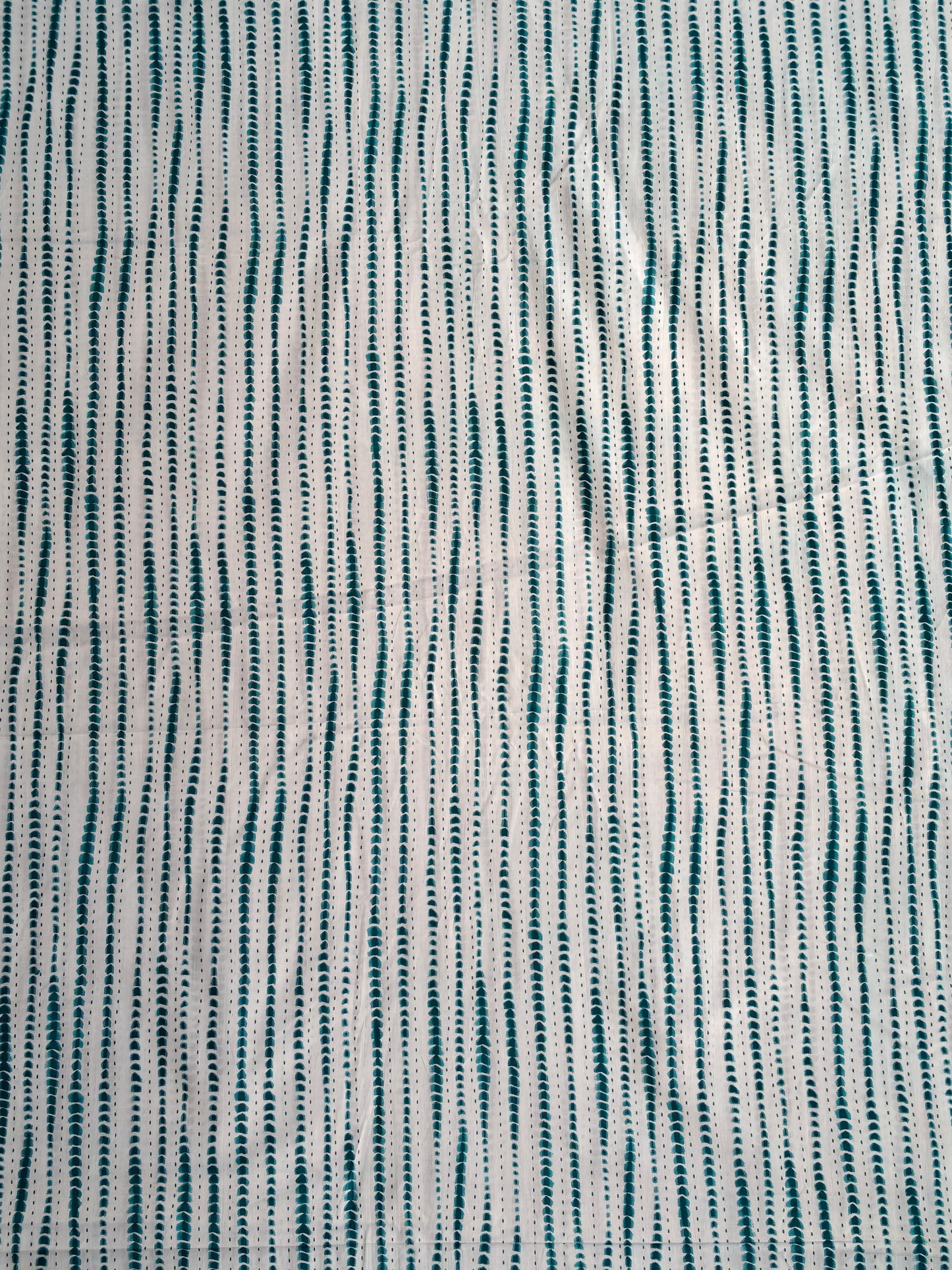 Green and white wavy stripes pattern fabric