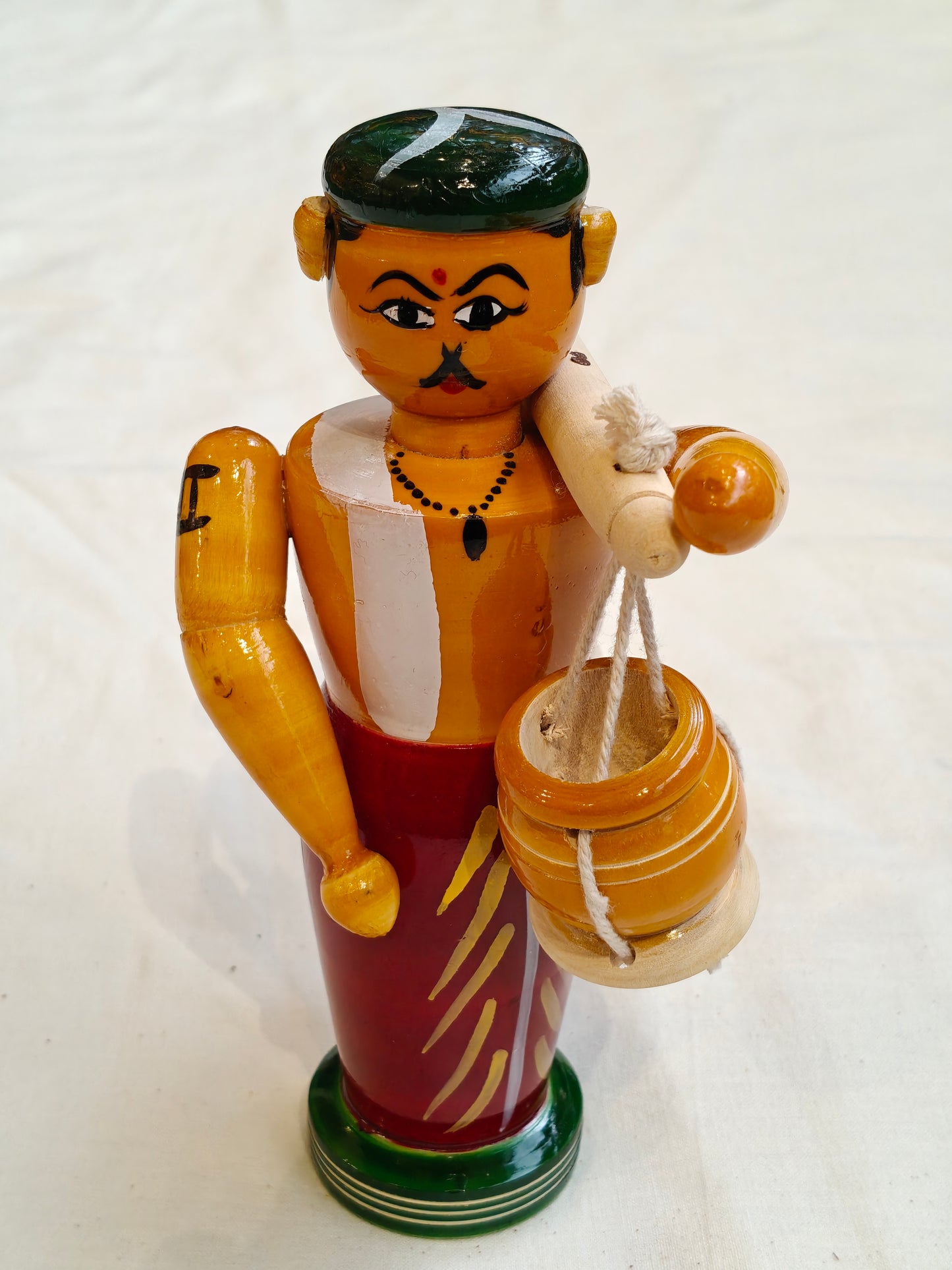 Man carrying pots by shoulder pole - Handcrafted wooden decor