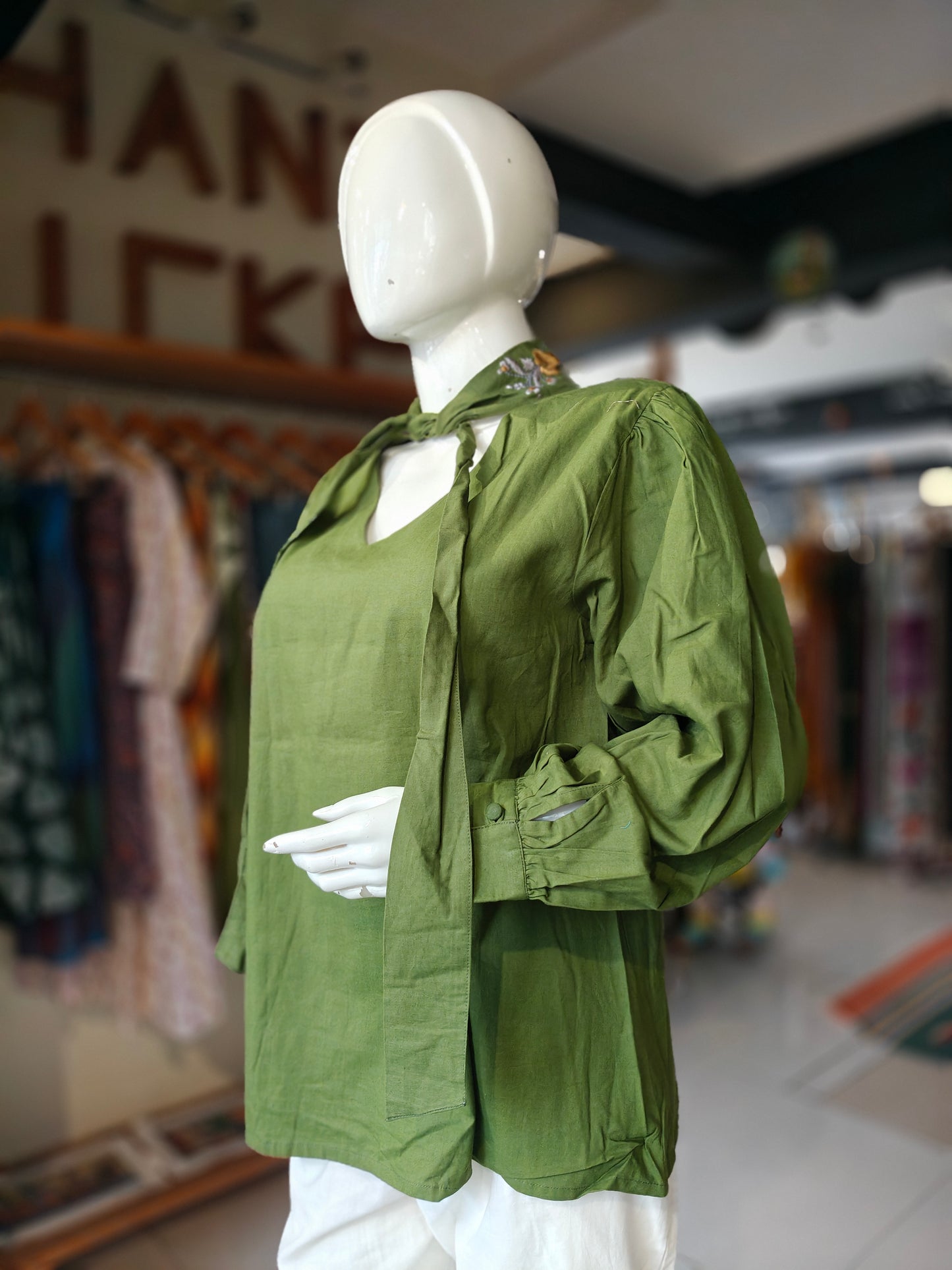 Green cotton top with embroidered collar and long sleeves