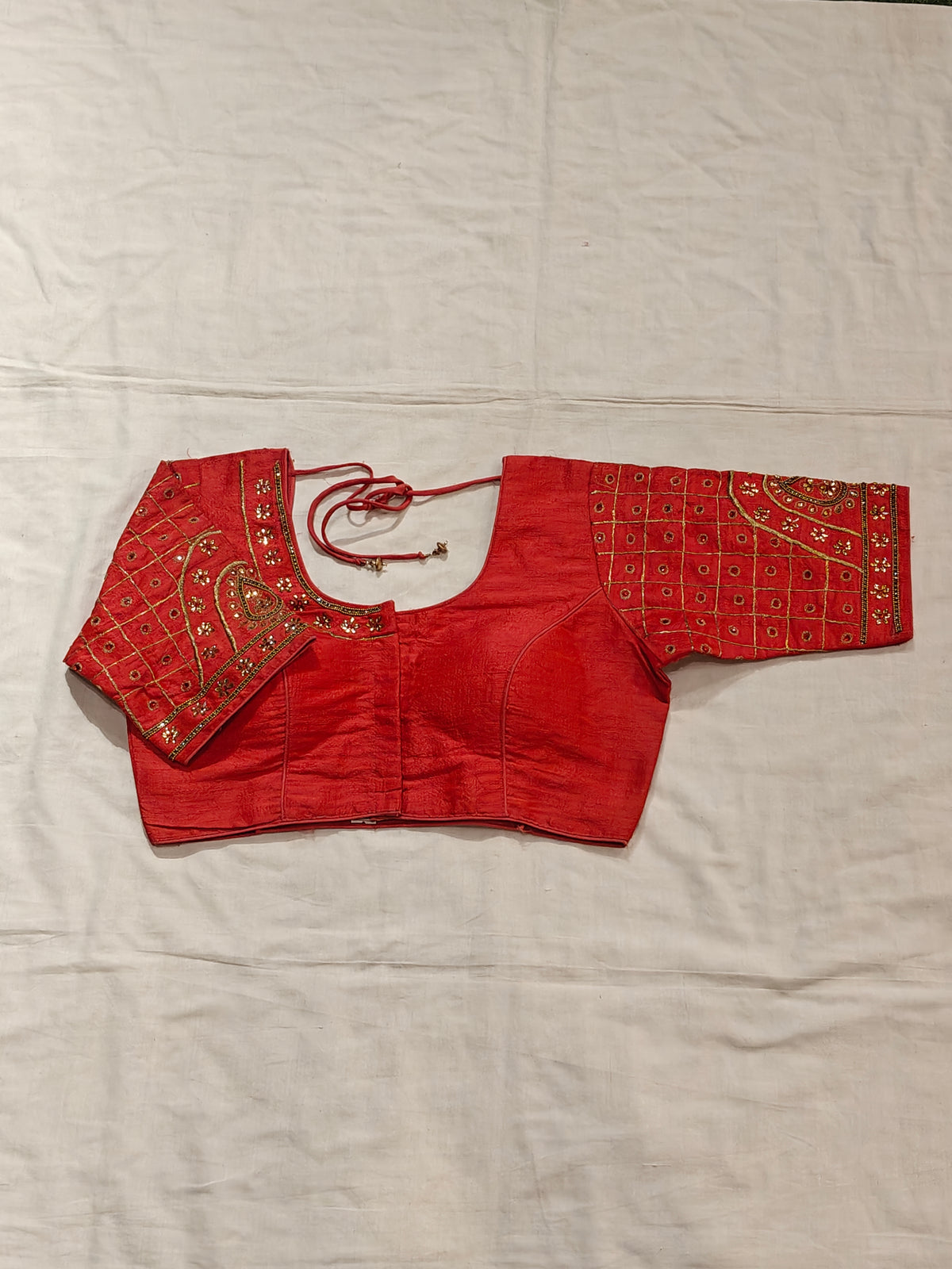 Blouse with golden embroidery and stonework on sleeves and half neck