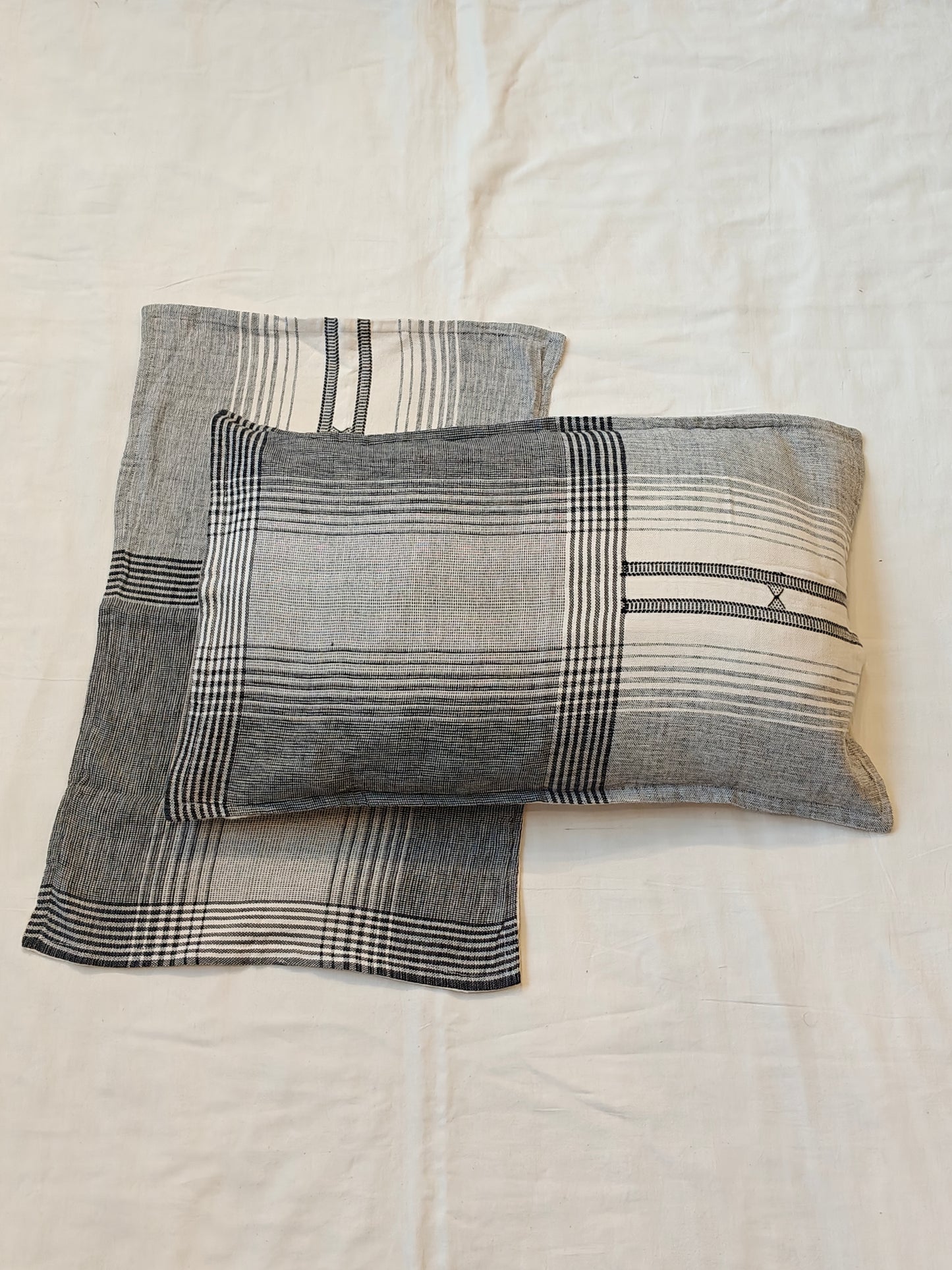 Handwoven black n white pillow cover featuring striped patterns
