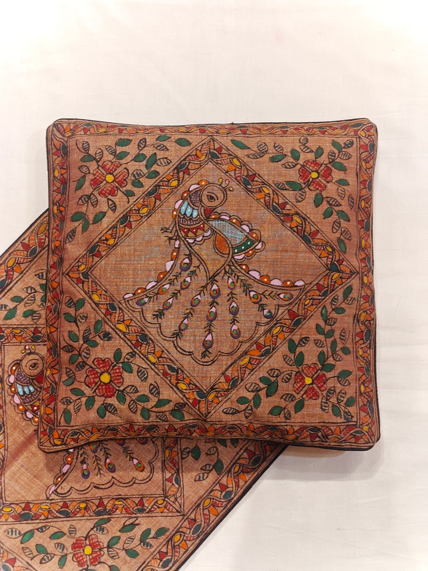 Brown cushion cover with Madhubani peacock hand painted designs