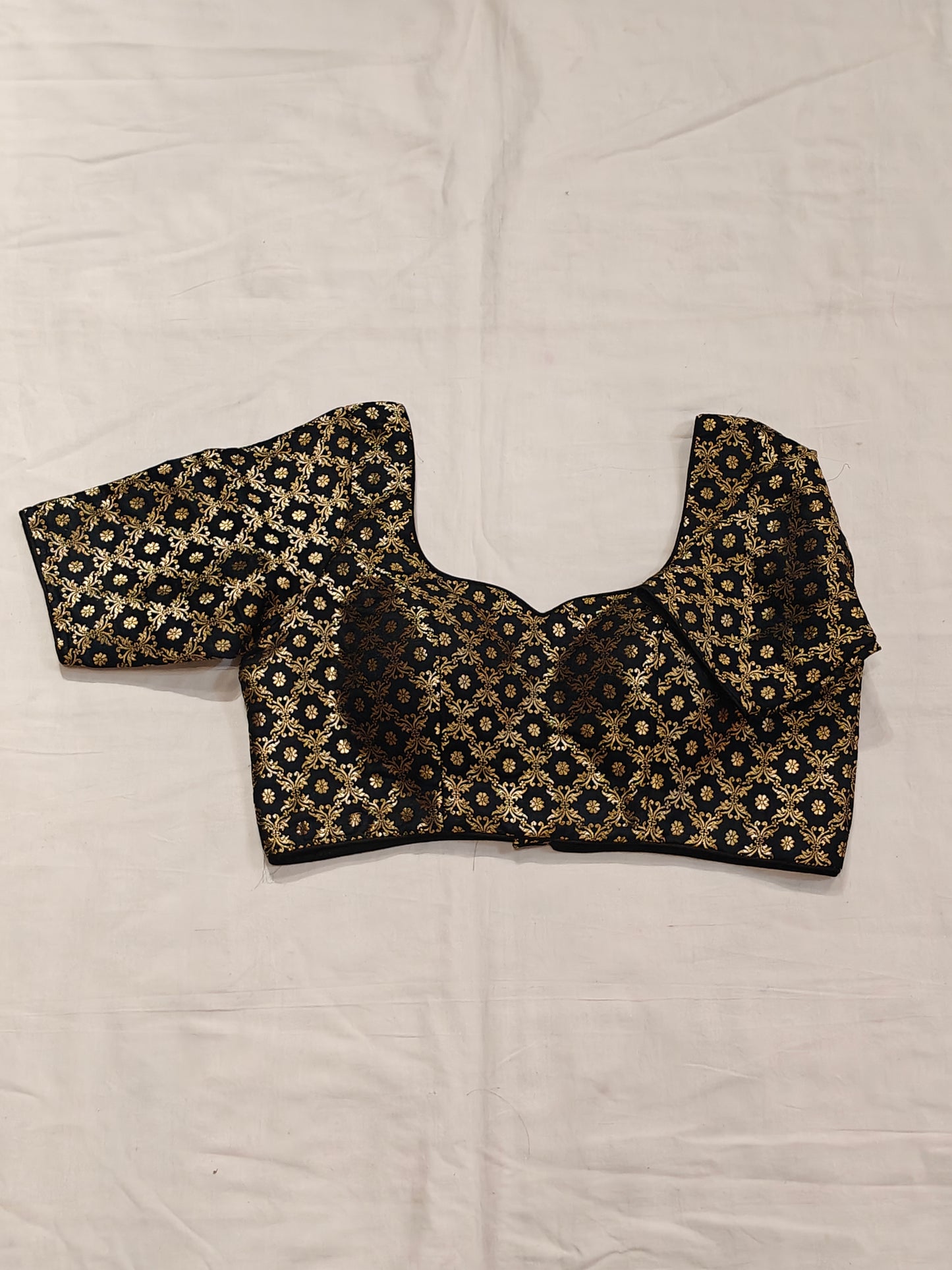 Golden floral prints on black katan silk blouse