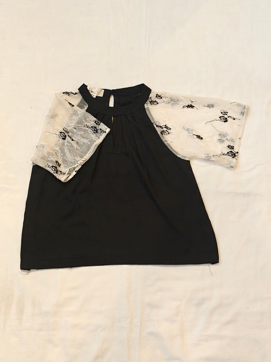 Black top with white lace sleeves