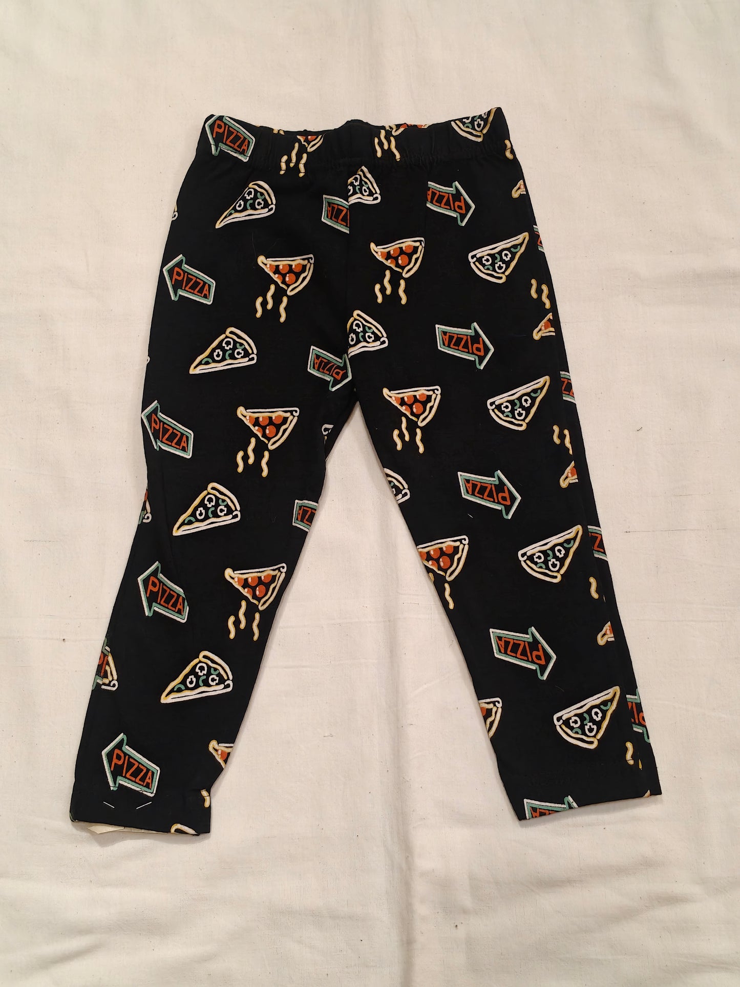 Black pants with pizza prints for children