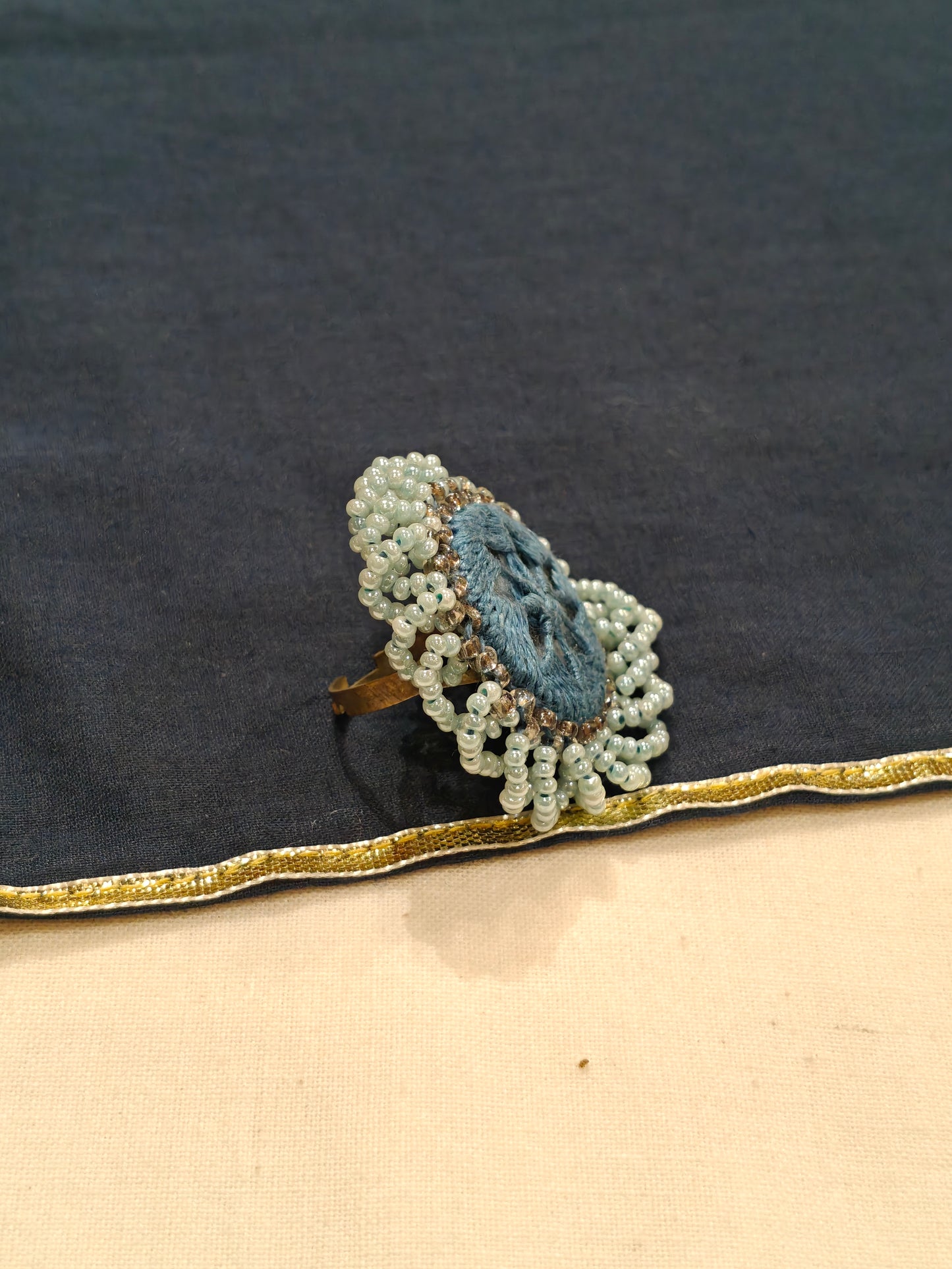Handcrafted finger ring with bead work and mirror