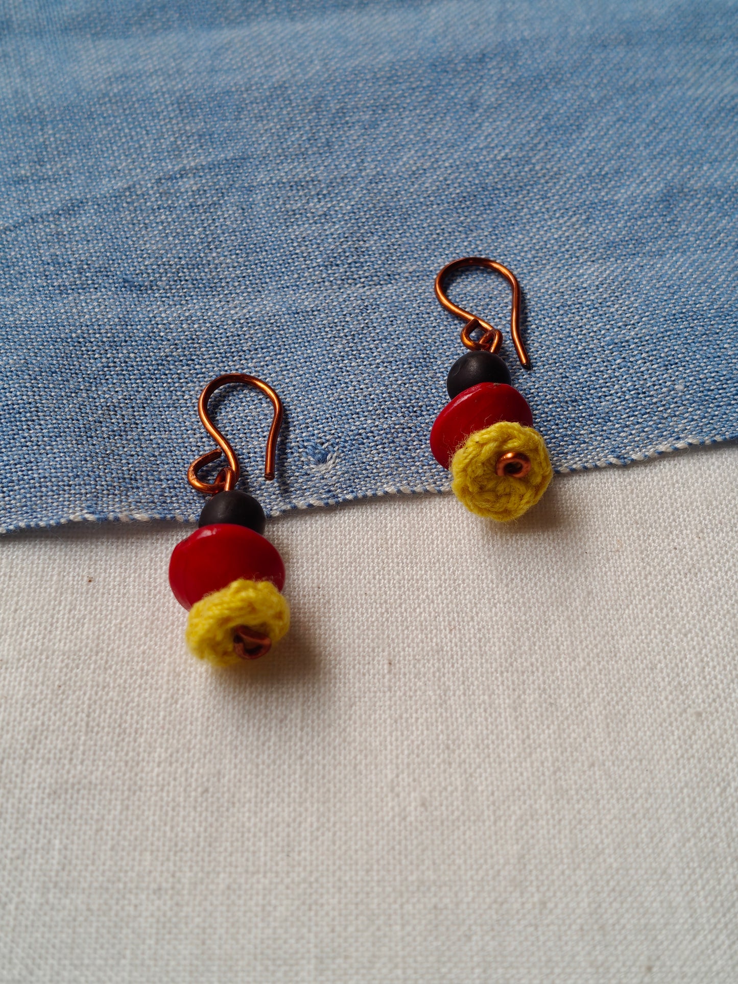 Handcrafted earrings with seeds and crochet flowers