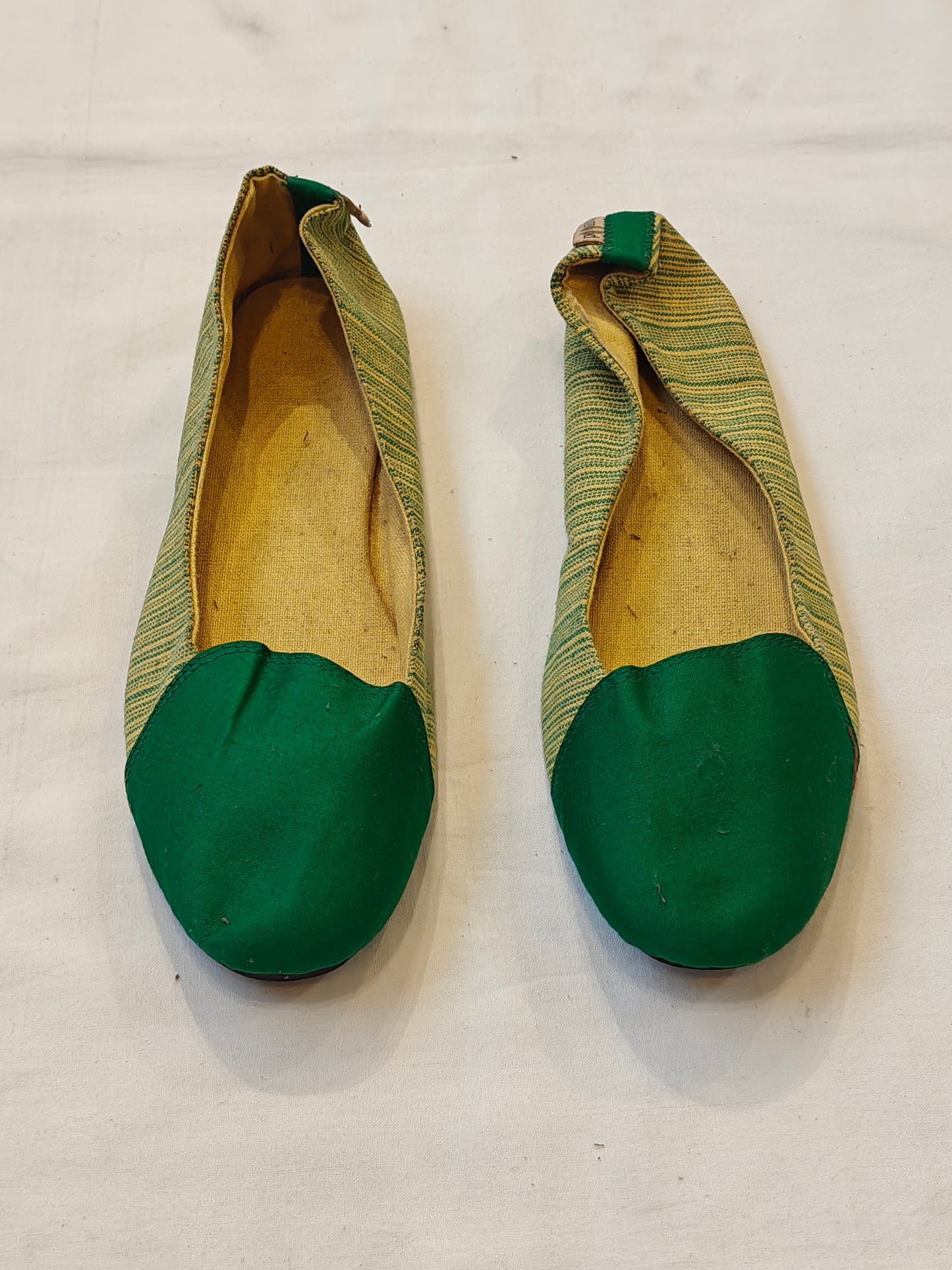 Green and yellow women's shoe with upcycled tyre base