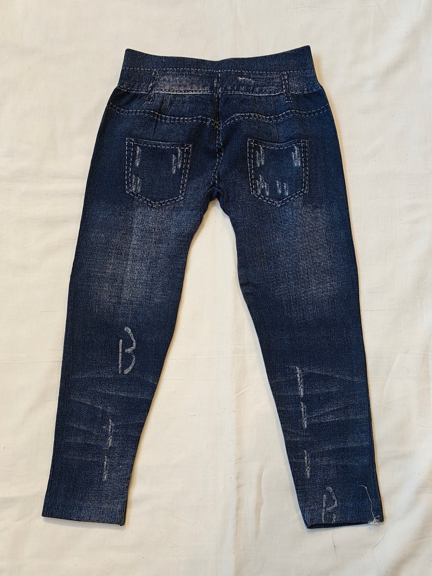 Dark blue jeggings with embroidered doll