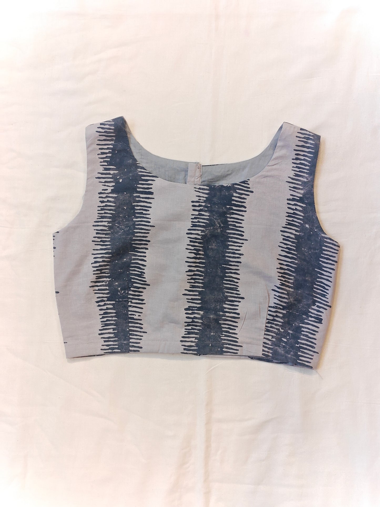 Grey with dark blue striped pattern sleeveless blouse