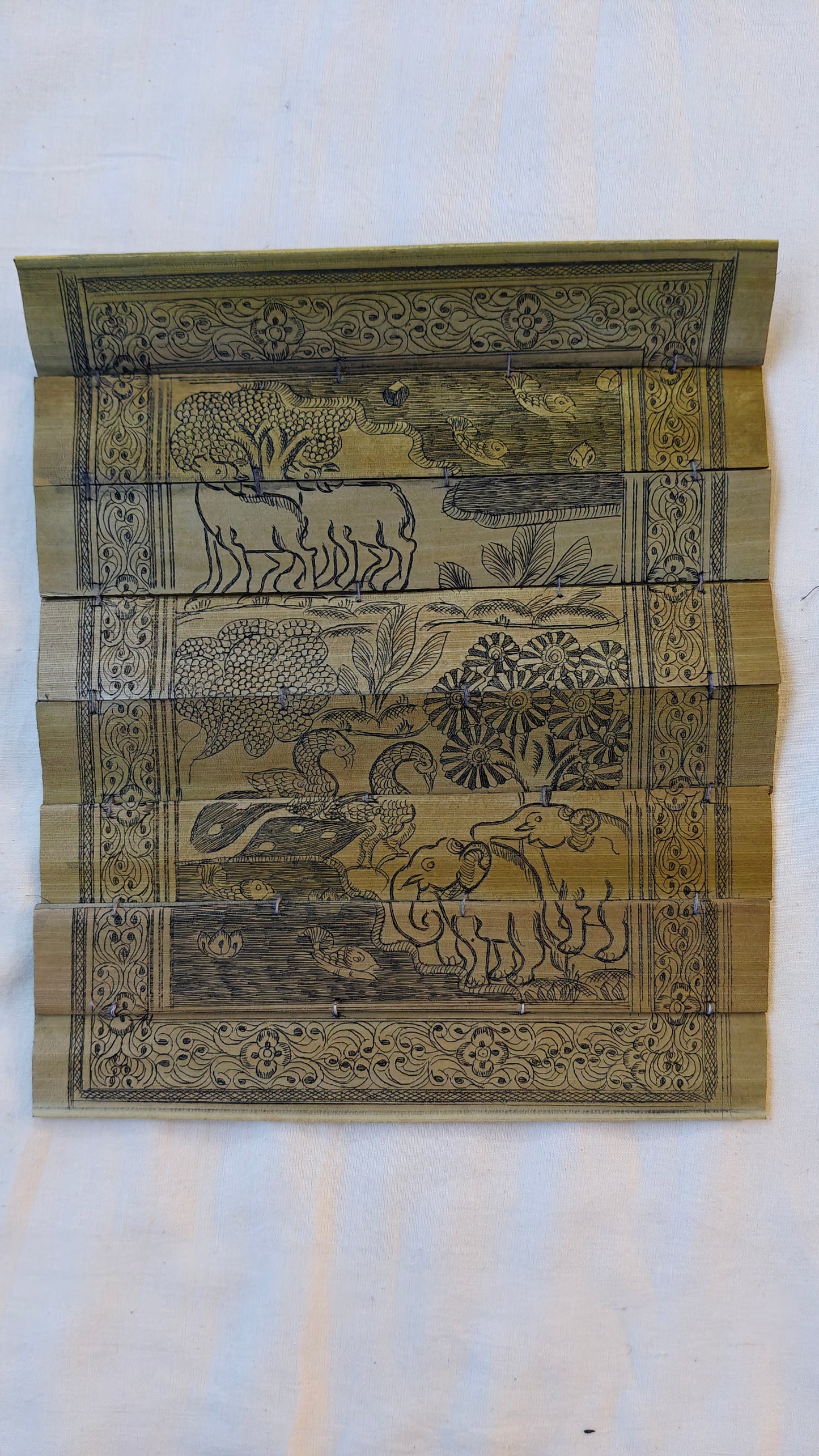 Patachitra hand-painted forest theme on palm leaves