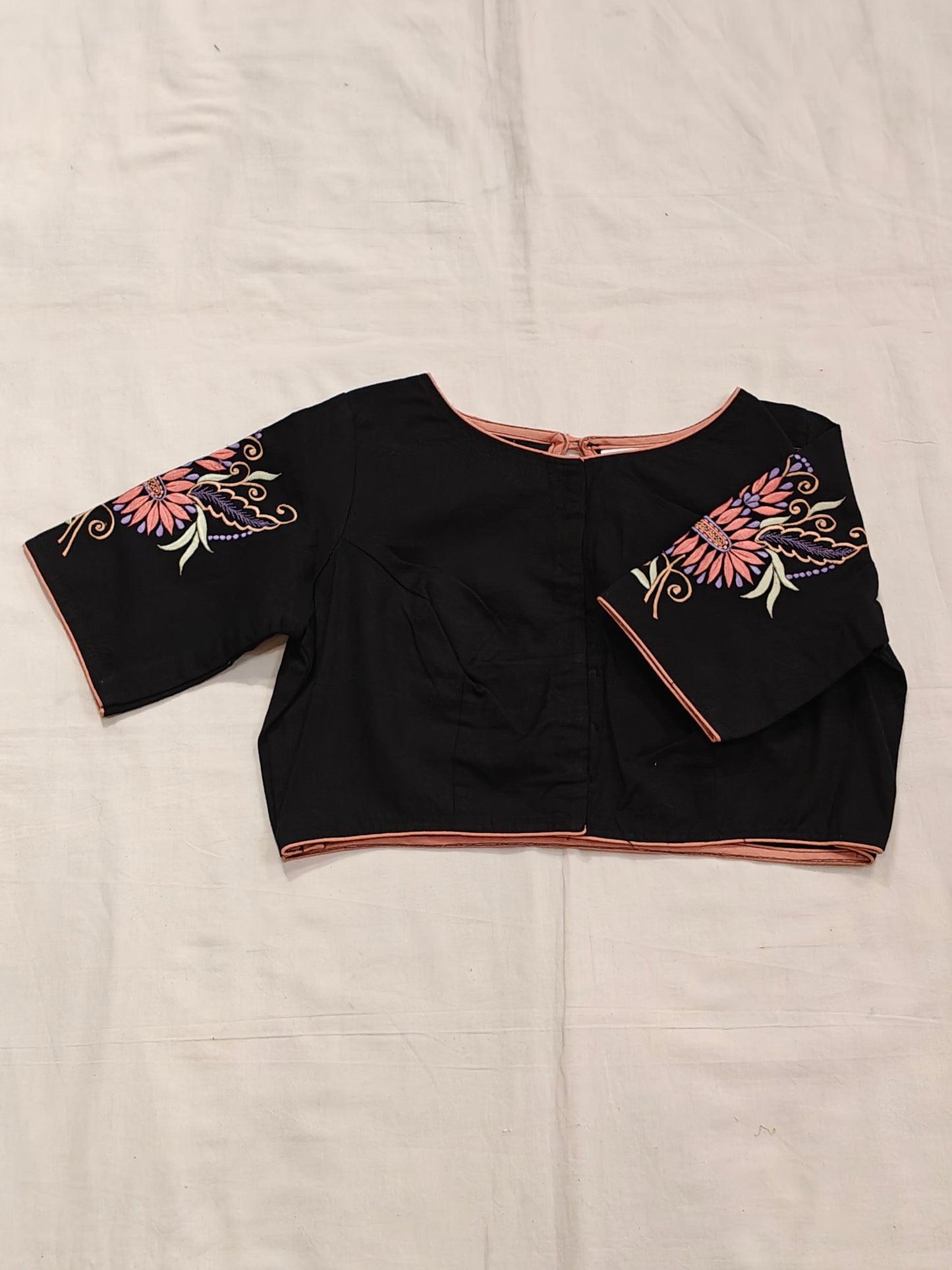 Black cotton blouse with floral embroidery, key hole back