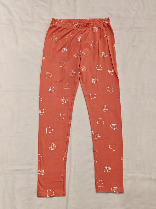 Peach leggings with heart prints for girls