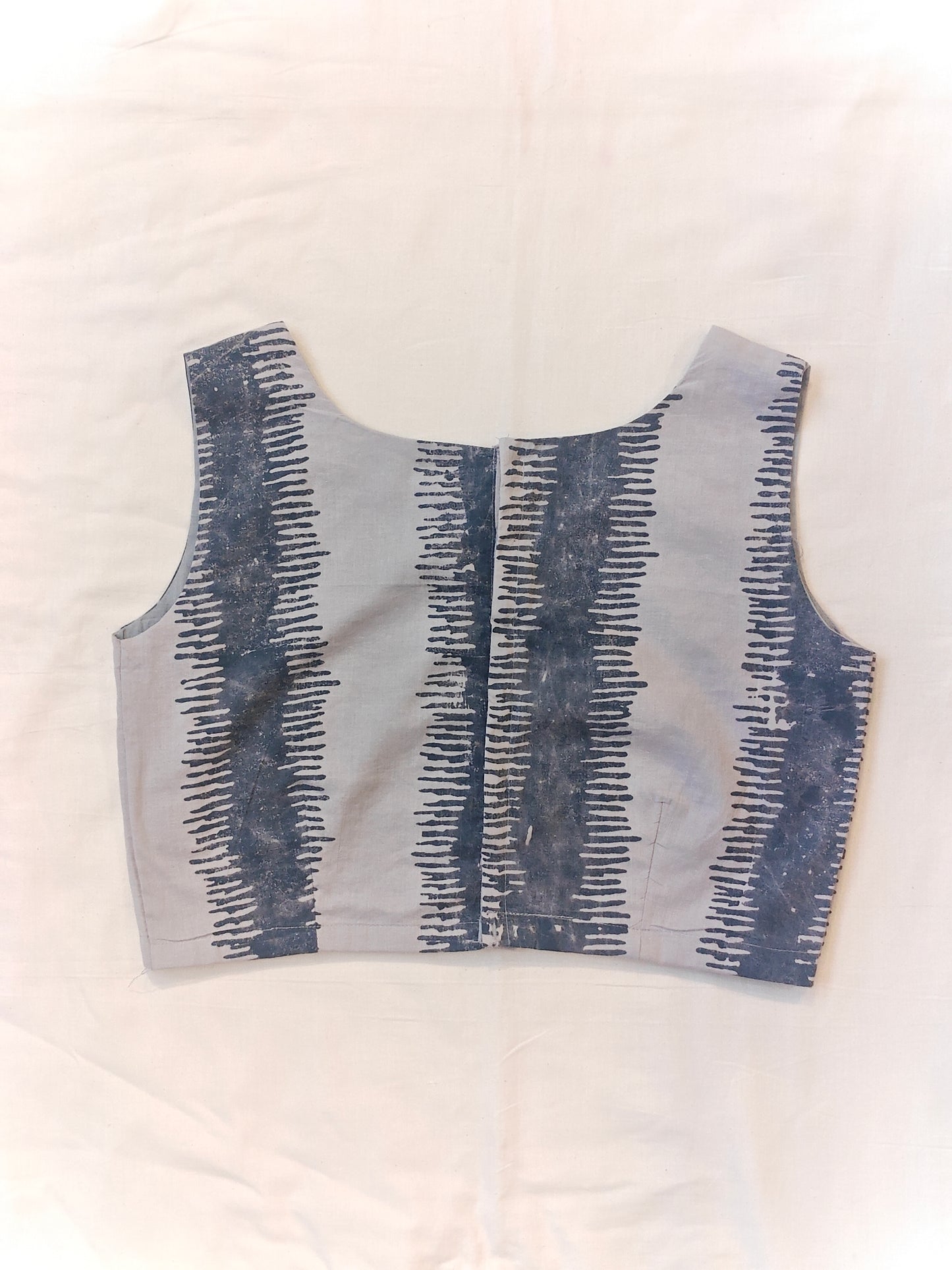 Grey with dark blue striped pattern sleeveless blouse