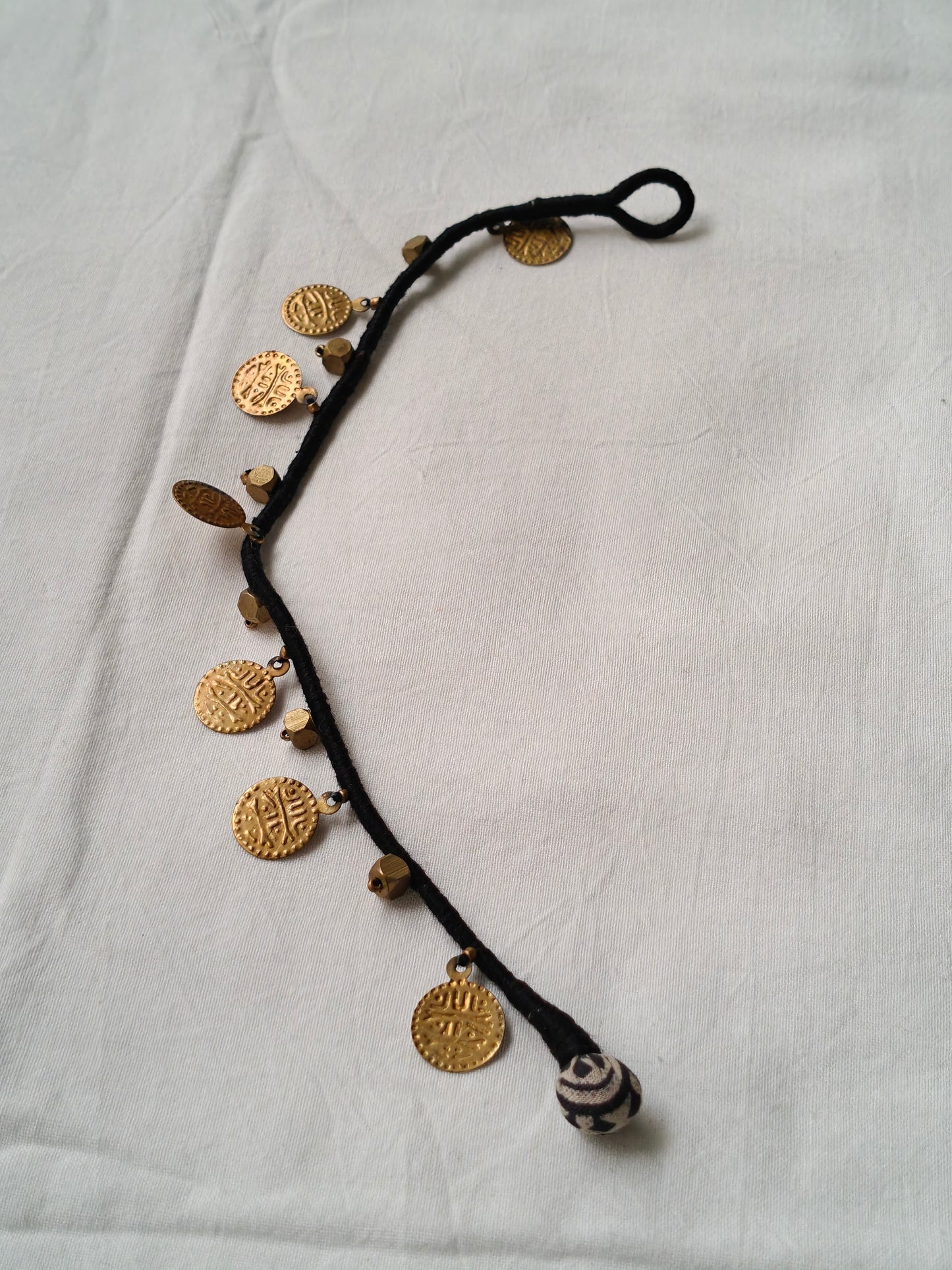 Brass single anklet with coins and beads in black thread