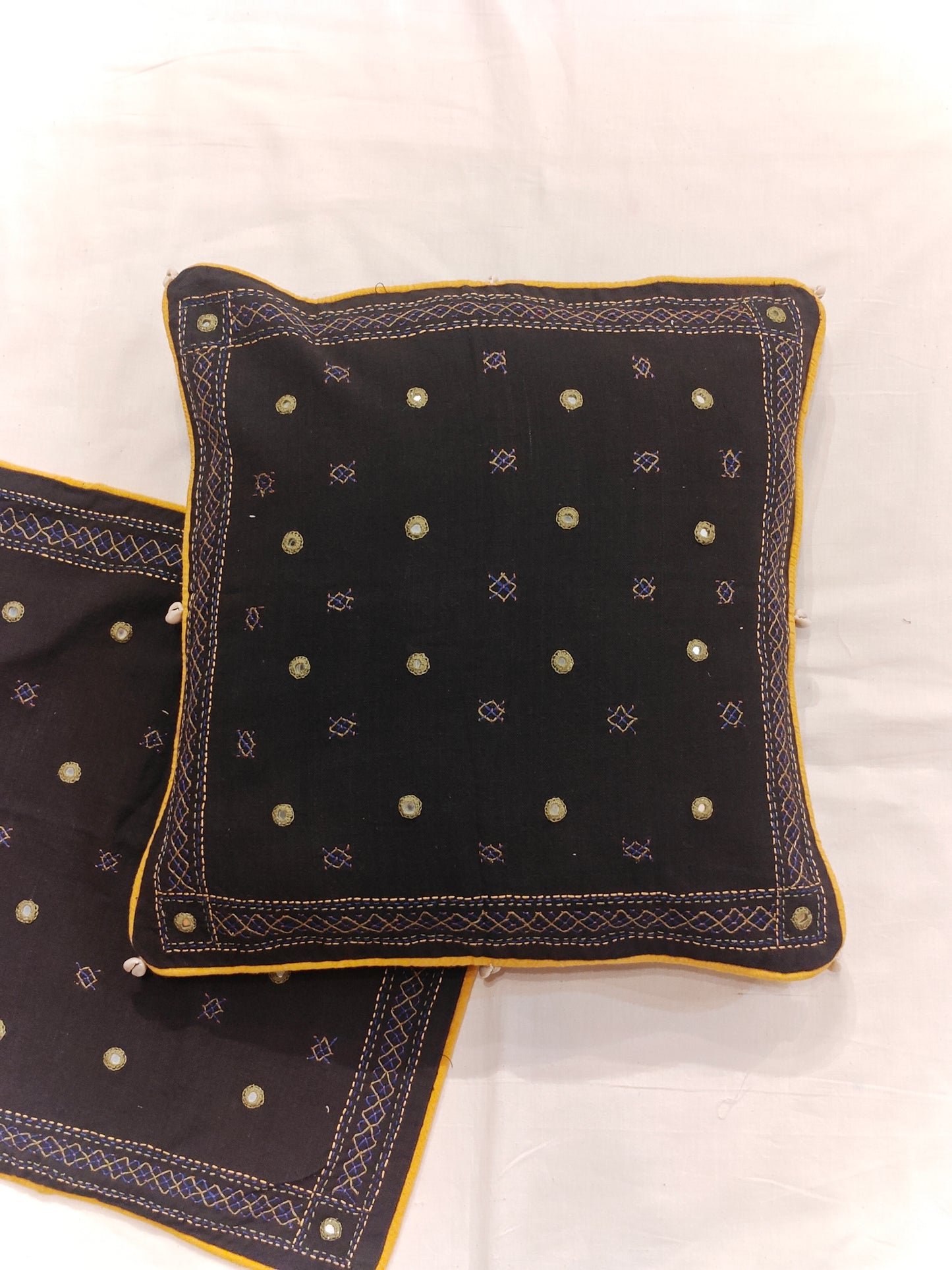 Black cushion cover with mirror hand embroidery and shells