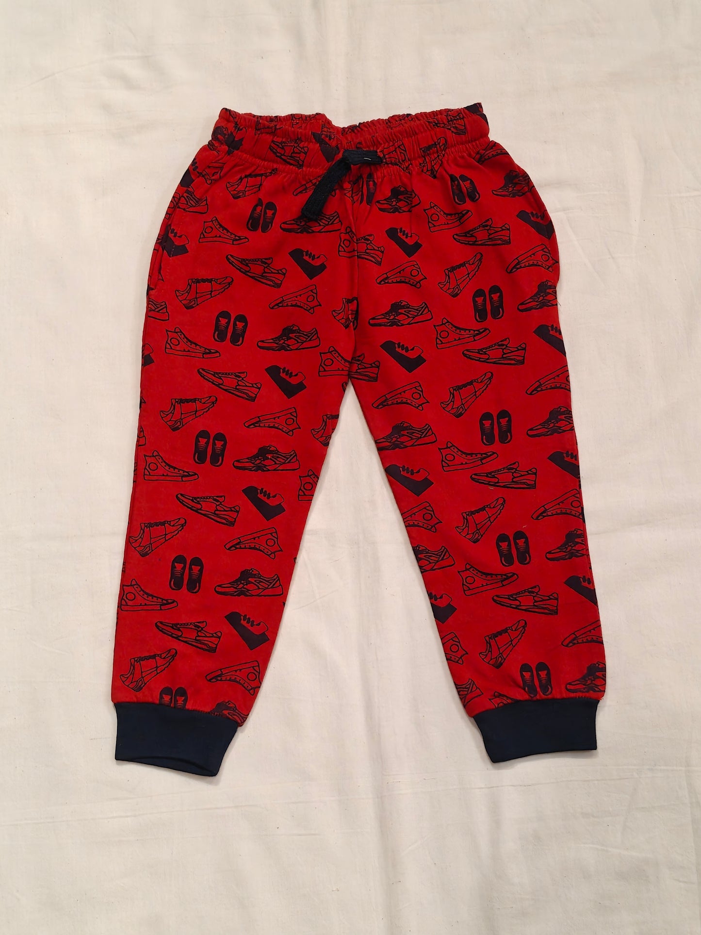 Red cotton jogger pants with shoes print for children