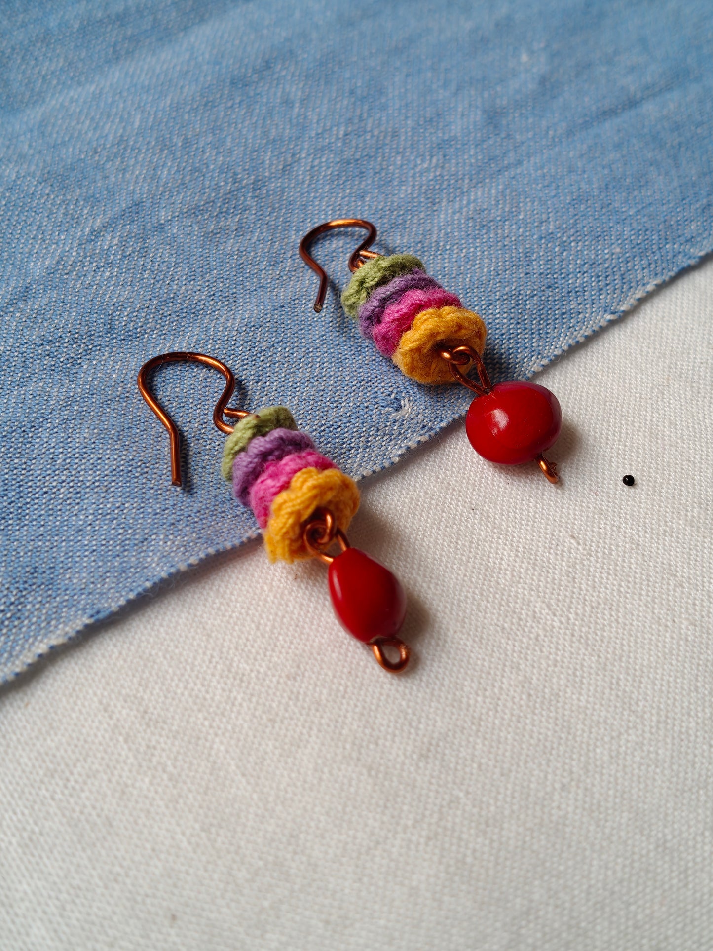 Handcrafted earrings with seeds and crochet flowers