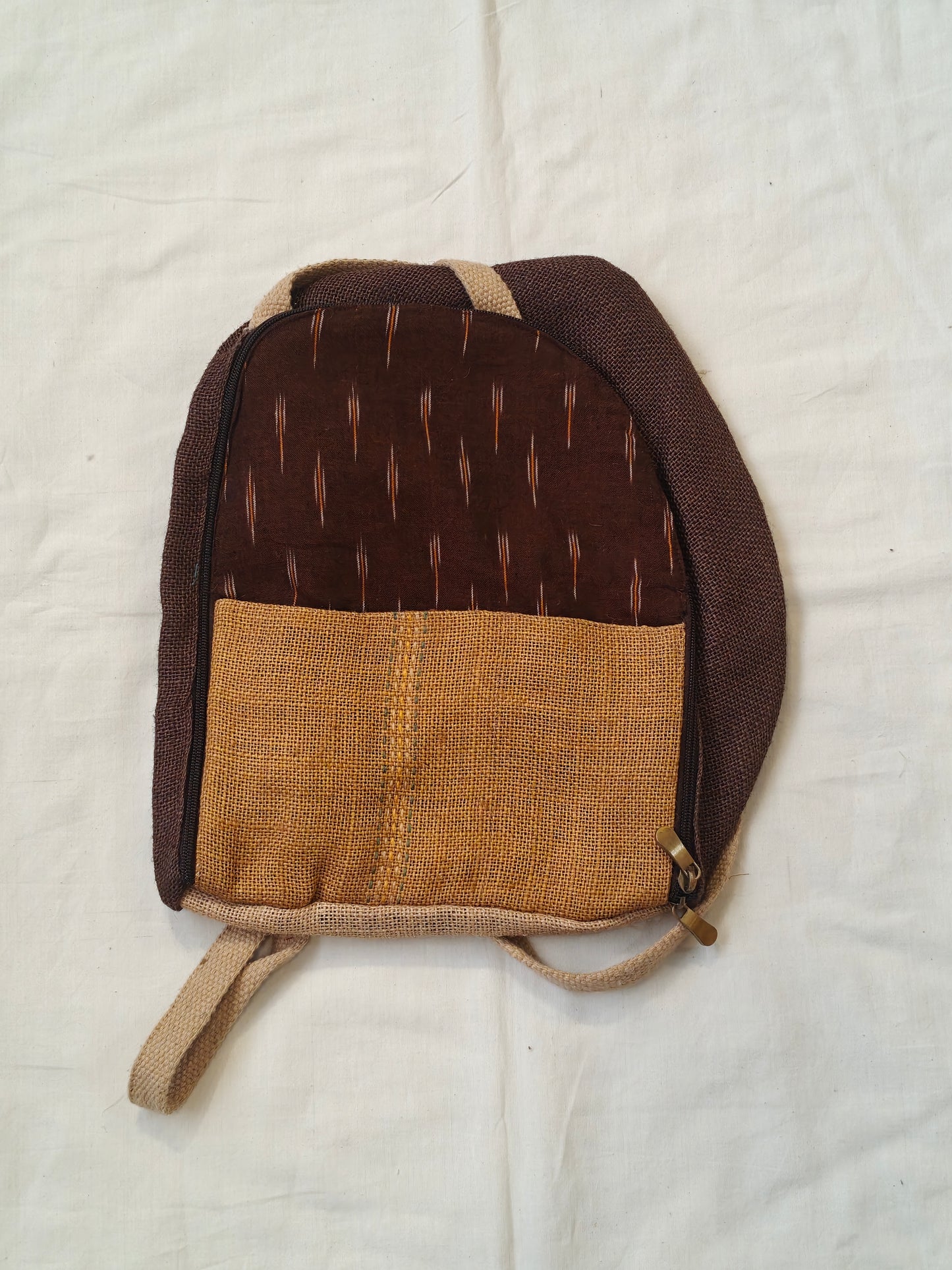 Day back pack cum handbag in jute with fabric panel