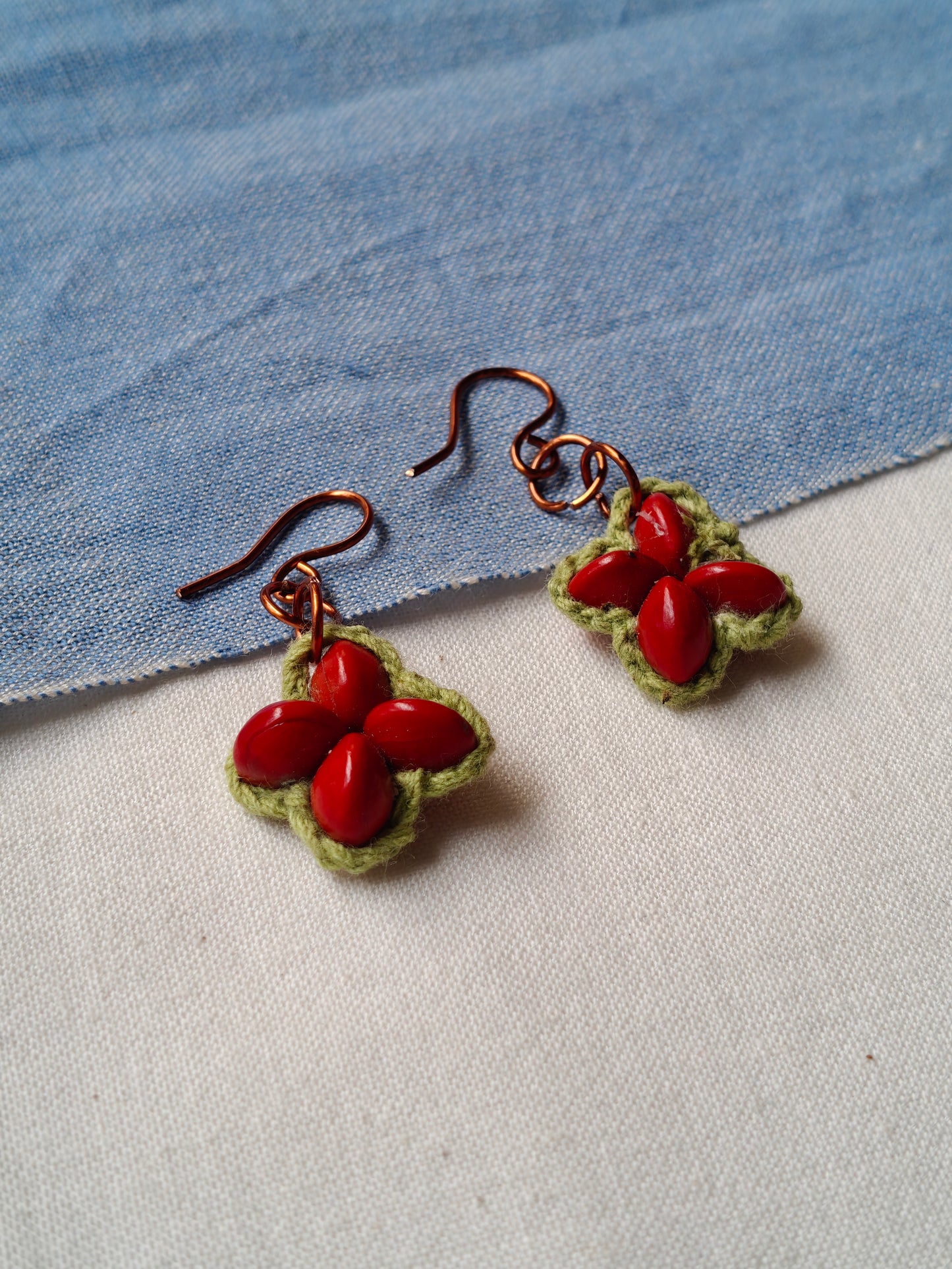 Handcrafted earrings with seeds and crochet flowers