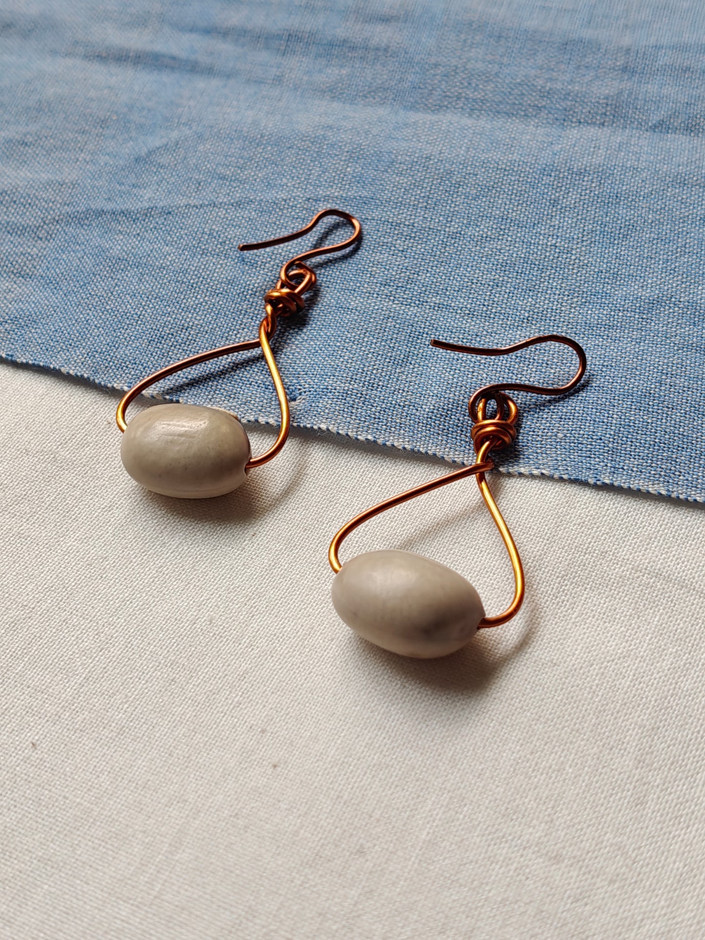 Handcrafted seed earrings with copper hooks