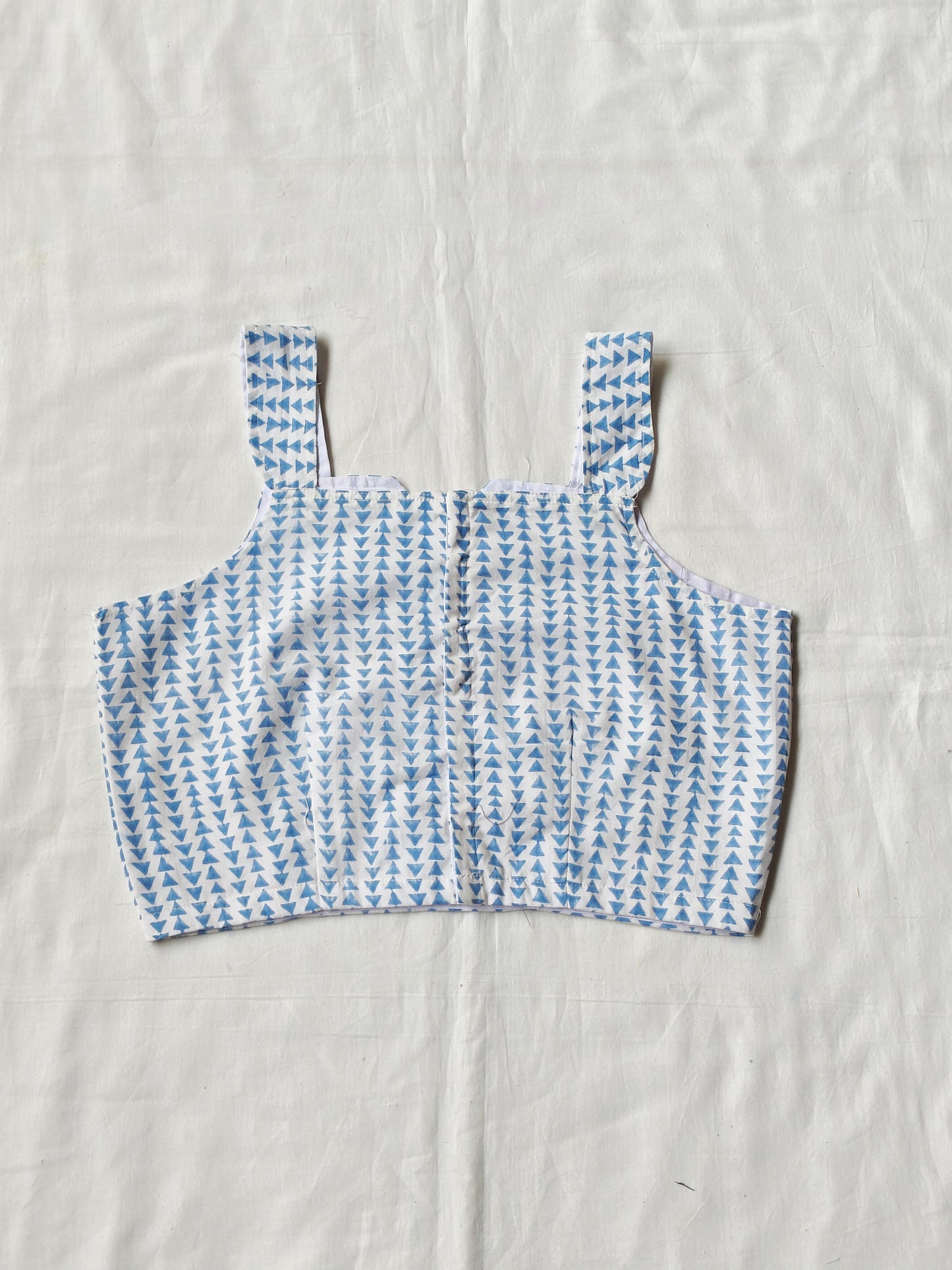Blue triangles hand block printed on white base - sleeveless cotton blouse