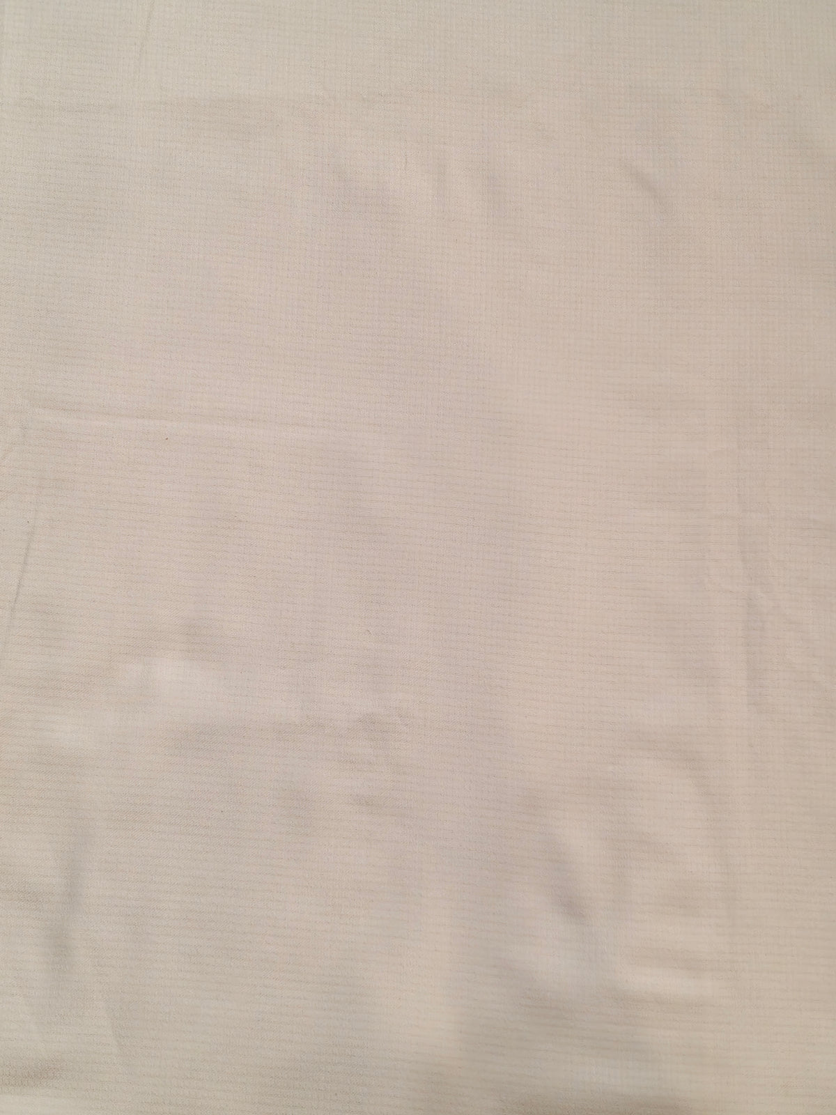 Plain white textured cotton fabric