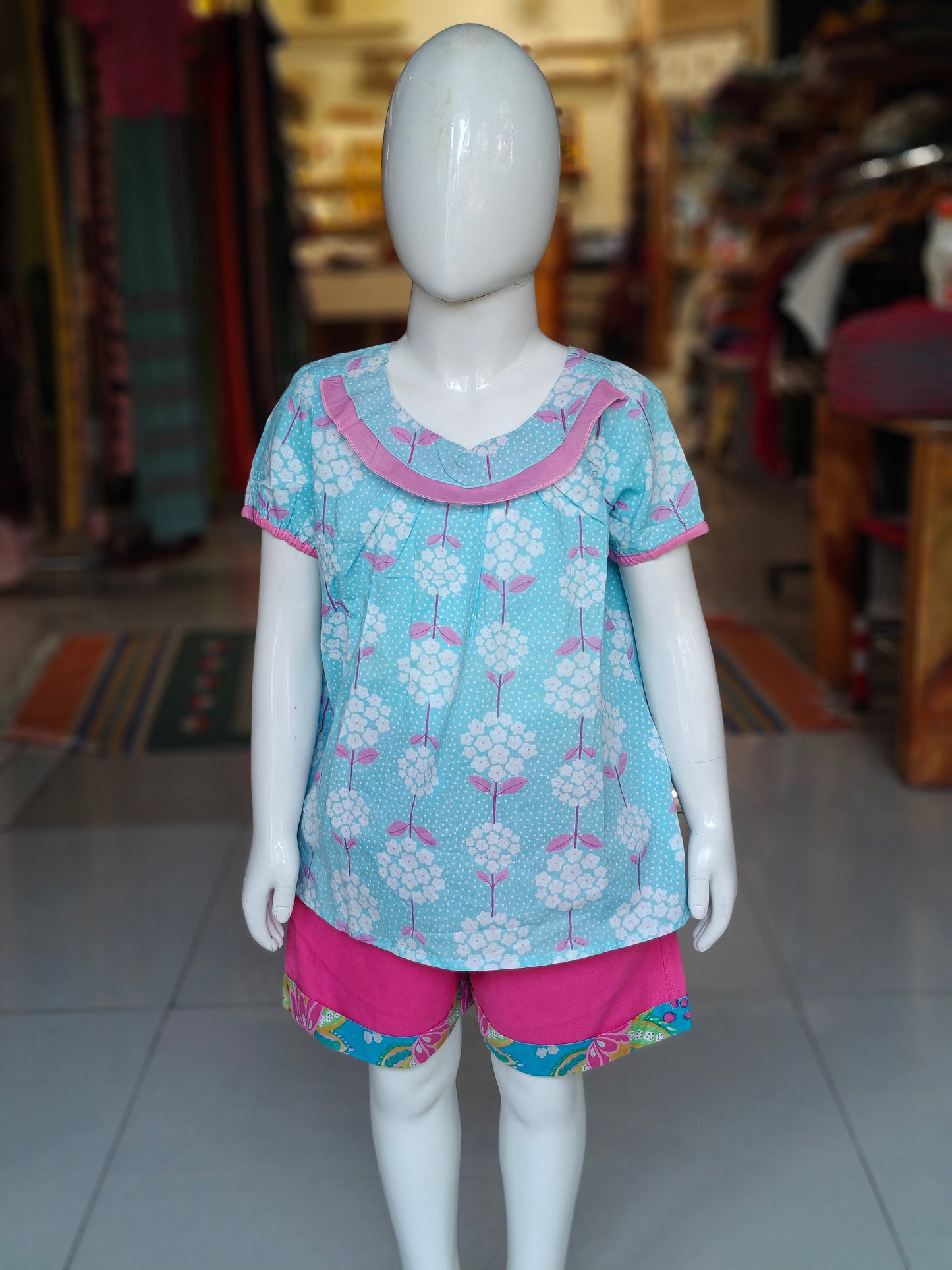 Light blue floral printed cotton top with matching pink shorts for girls