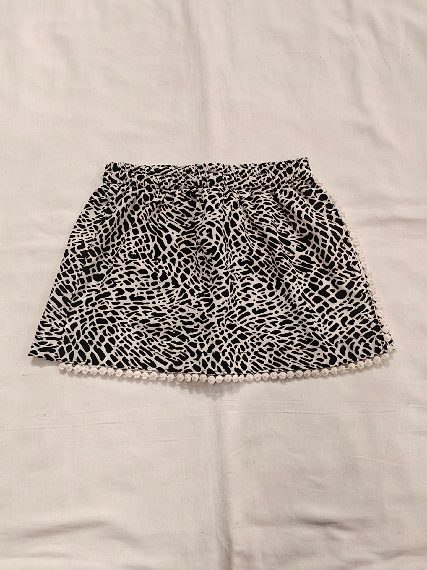Black n white skort ( skirt style shorts ) with pom pom trims