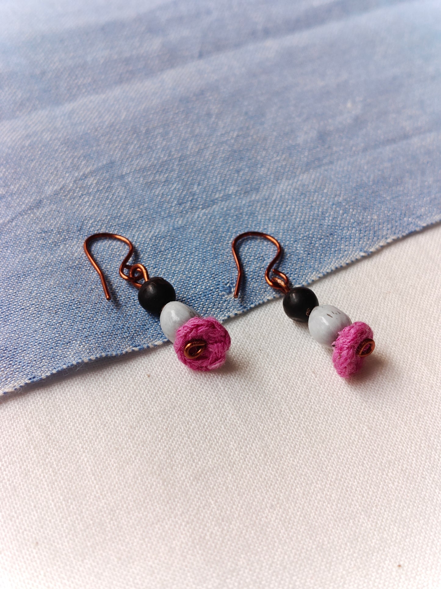 Handcrafted earrings with seeds and crochet flowers