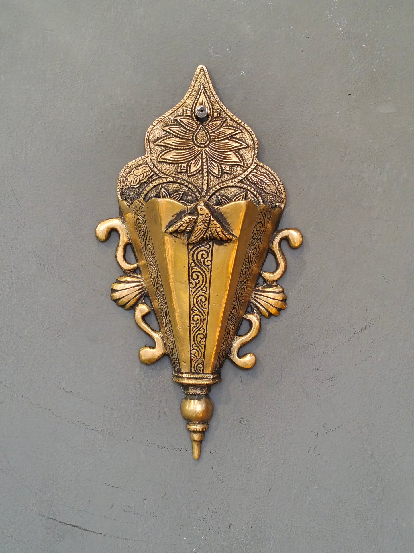 Brass wall pocket featuring intricate traditional engravings - wall decor cum organizer